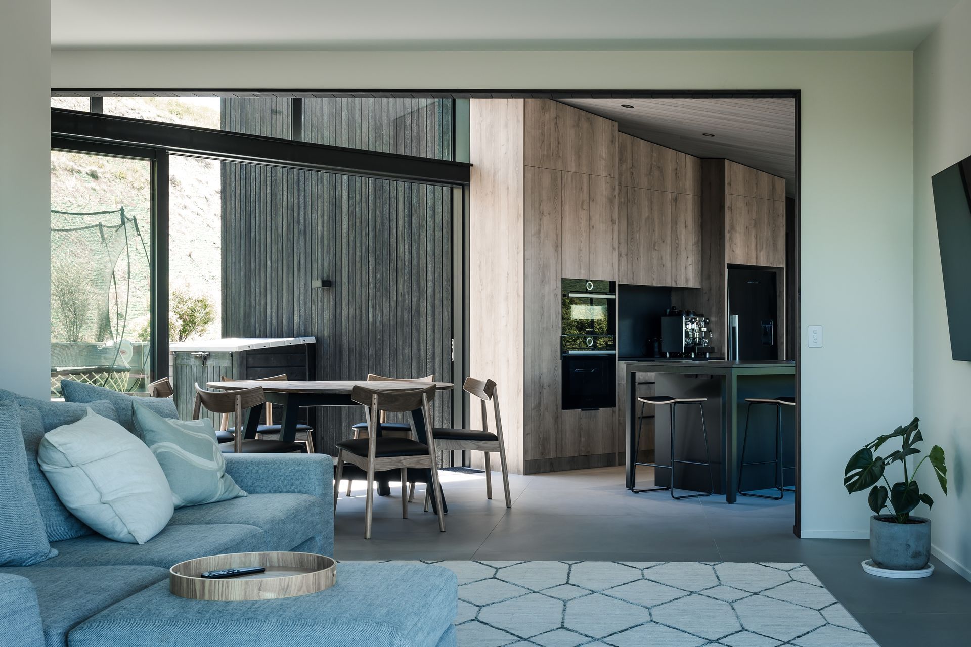 Large sliding doors create seamless indoor/outdoor flow