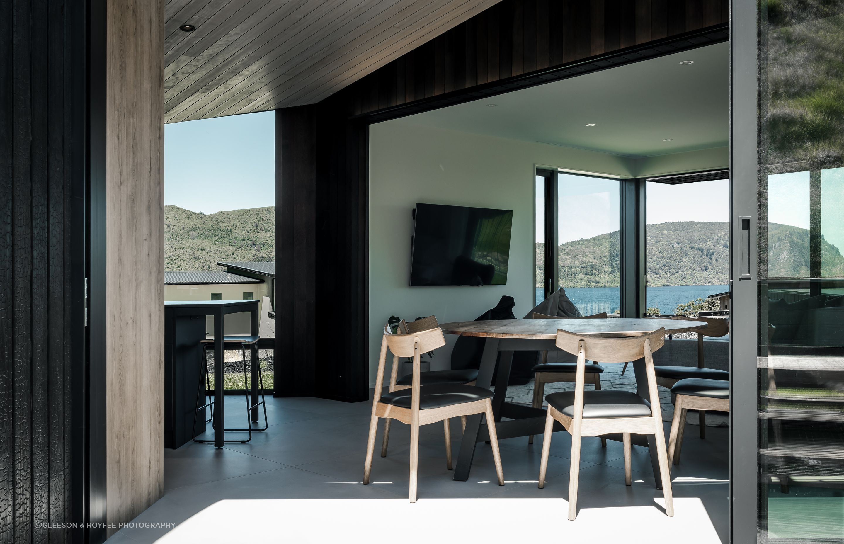 The Kinloch Retreat's kitchen/dining pavilion is angled to frame &amp; connect to Lake Taupō beyond