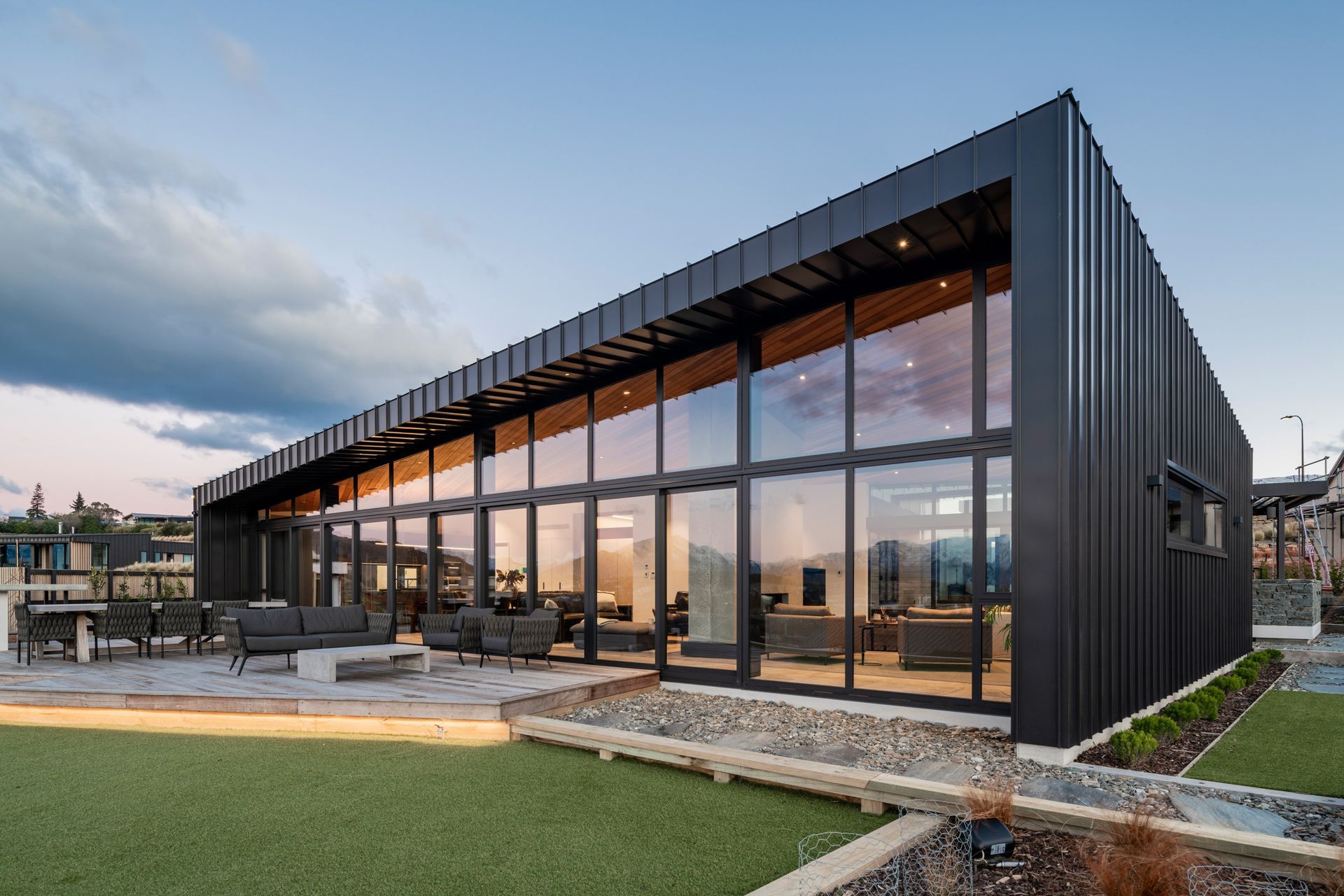 The back of the house features an entirely glazed wall and the high windows can open for a cross-flow of air.