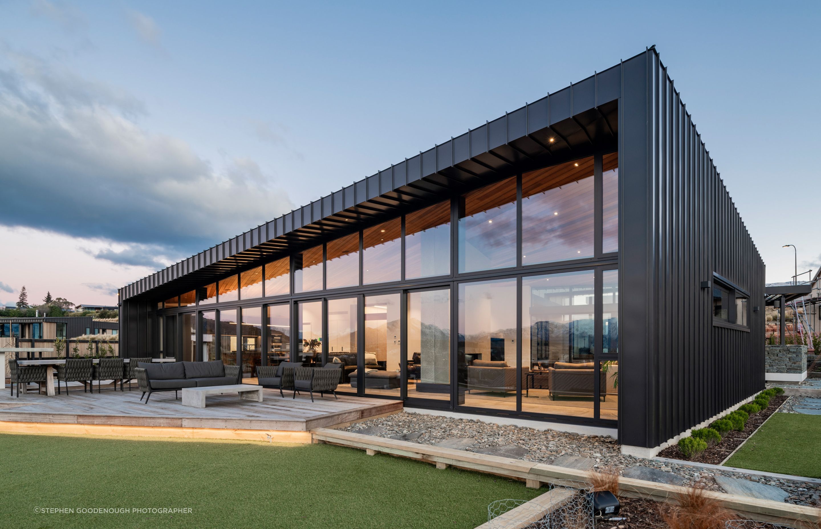 The back of the house features an entirely glazed wall and the high windows can open for a cross-flow of air.