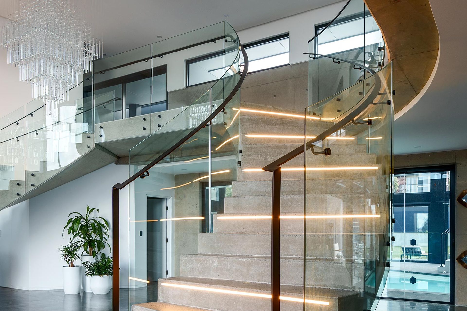 The Esplanade – Twin Bent Glass Curved Staircase