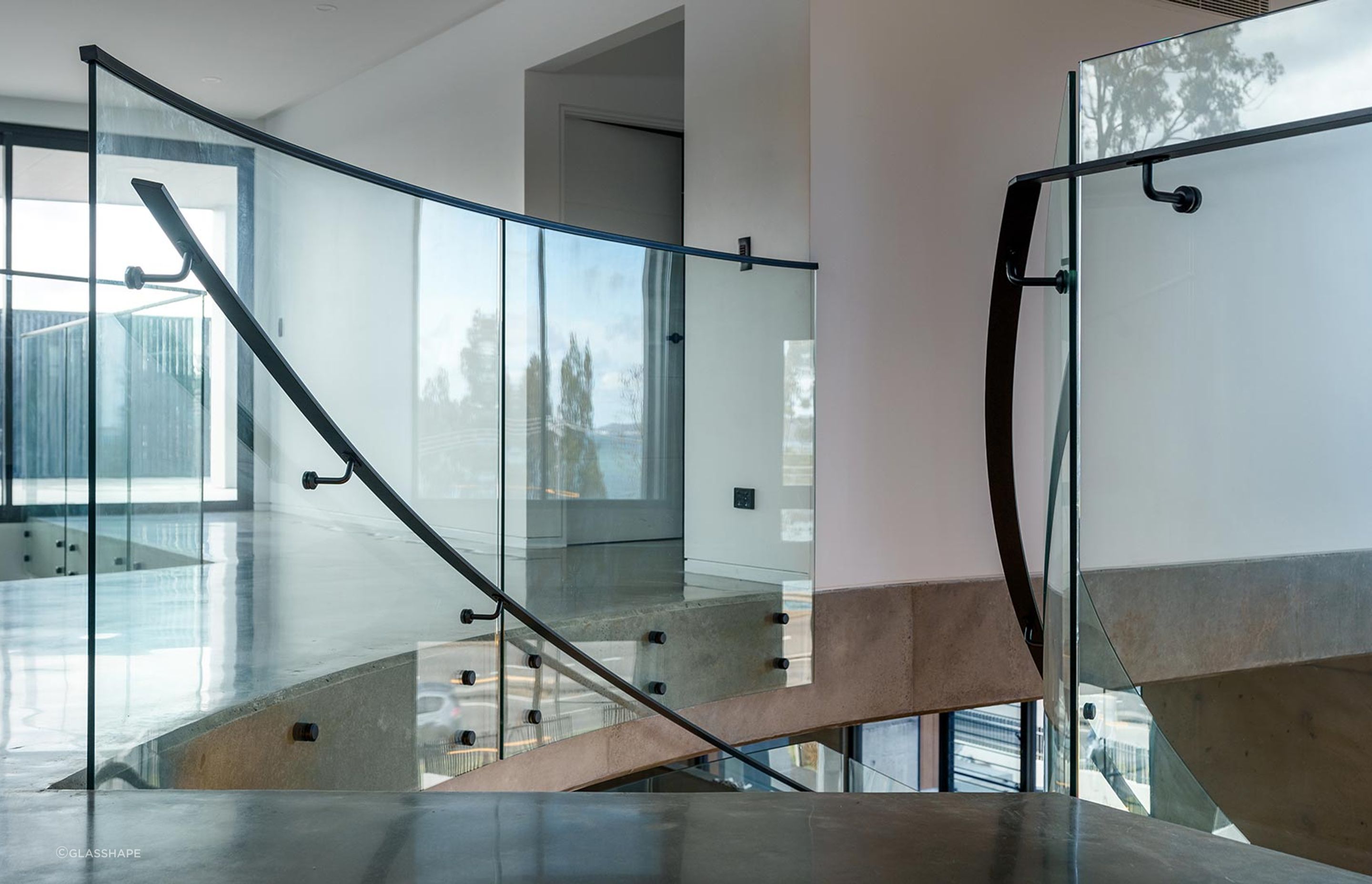 The Esplanade – Twin Bent Glass Curved Staircase
