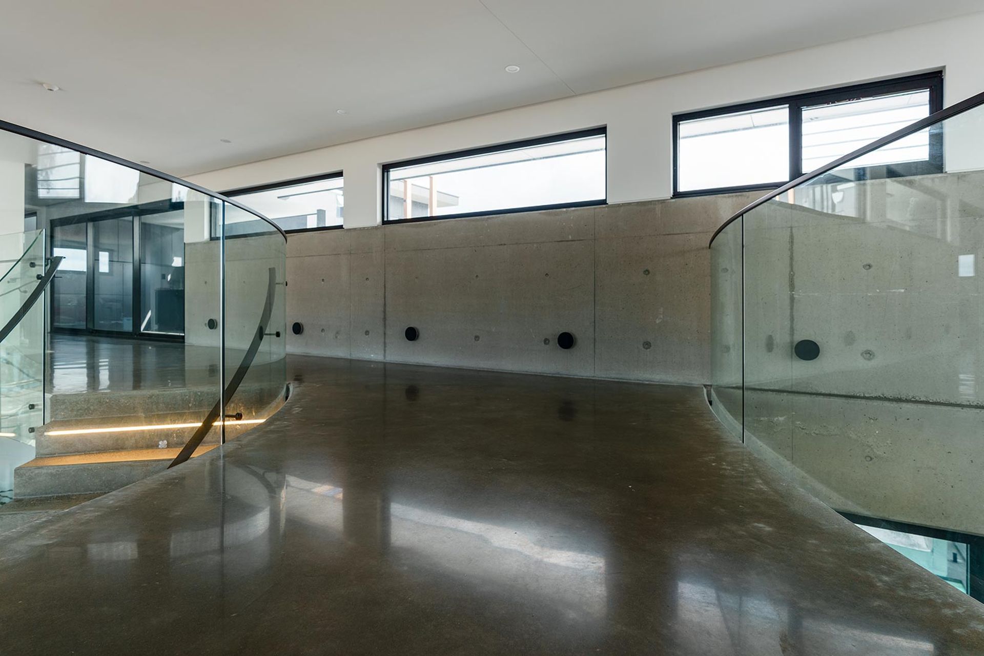 The Esplanade – Twin Bent Glass Curved Staircase