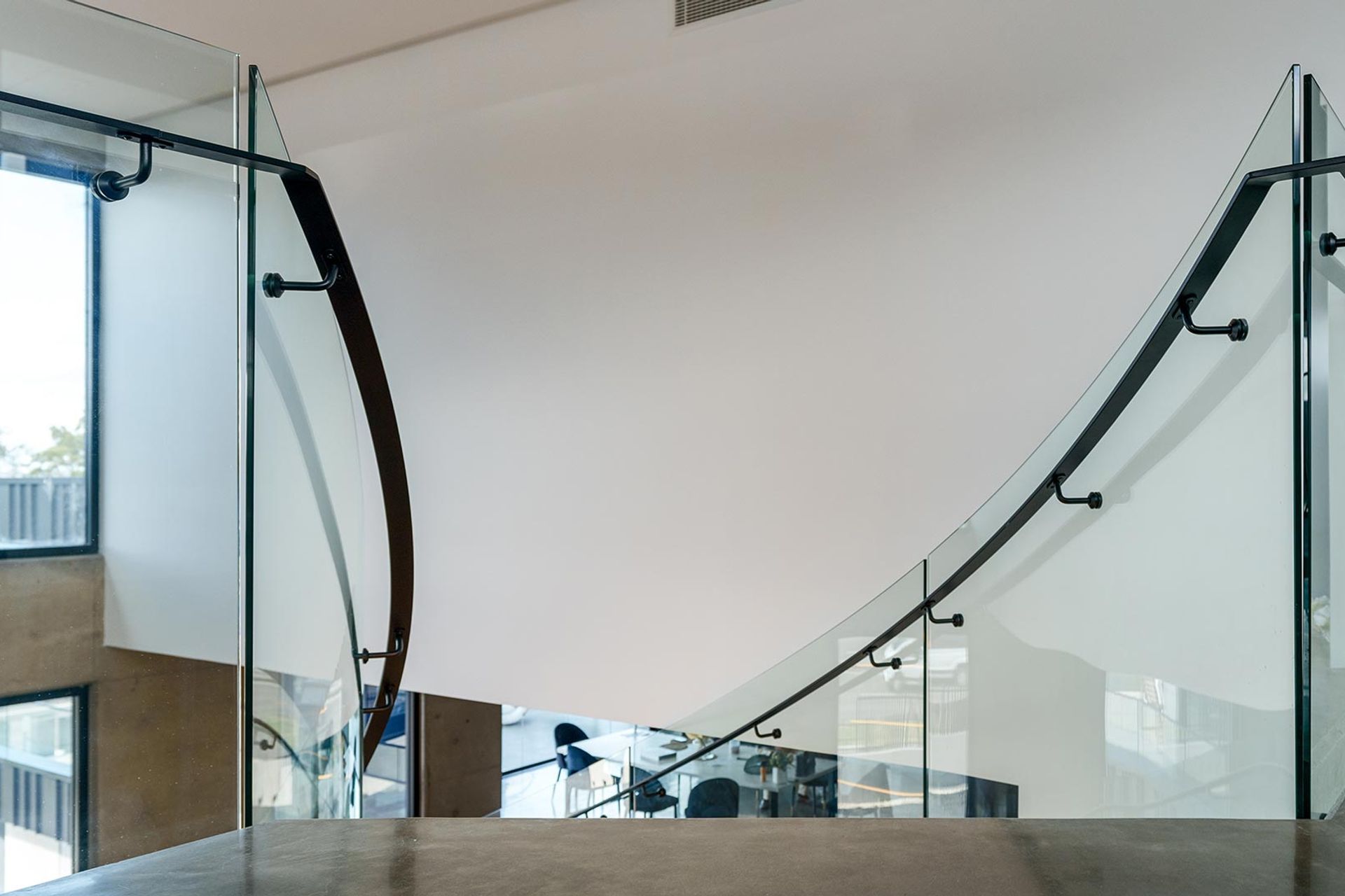 The Esplanade – Twin Bent Glass Curved Staircase