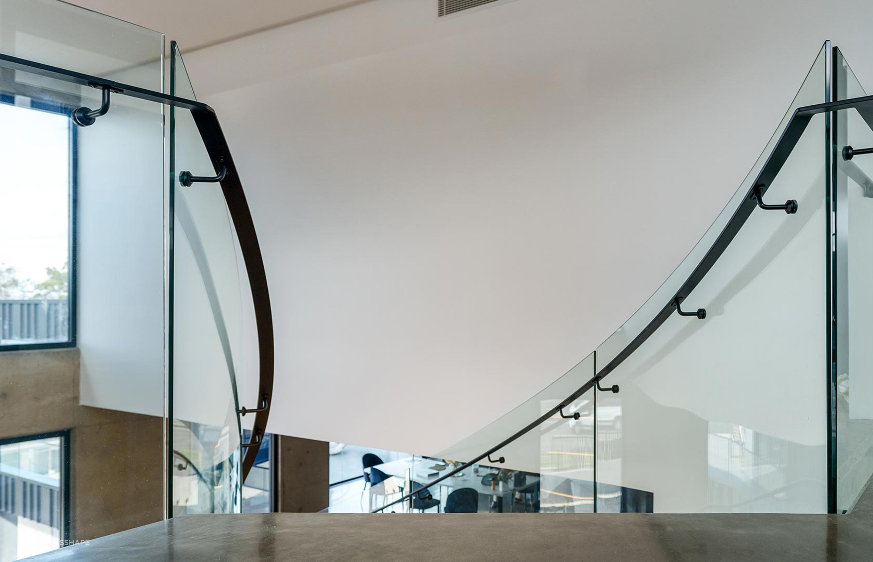 The Esplanade – Twin Bent Glass Curved Staircase