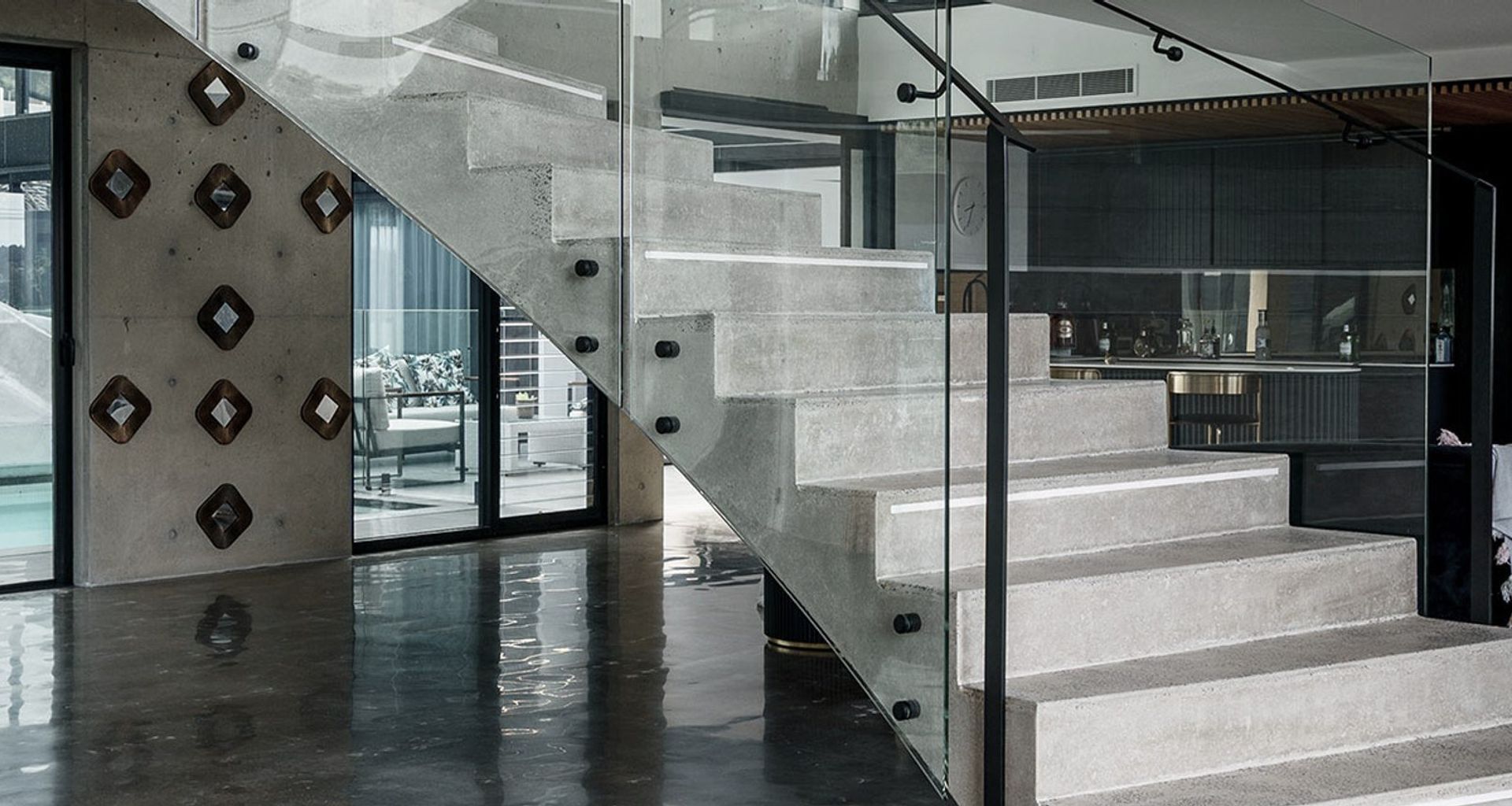 The Esplanade – Twin Bent Glass Curved Staircase banner