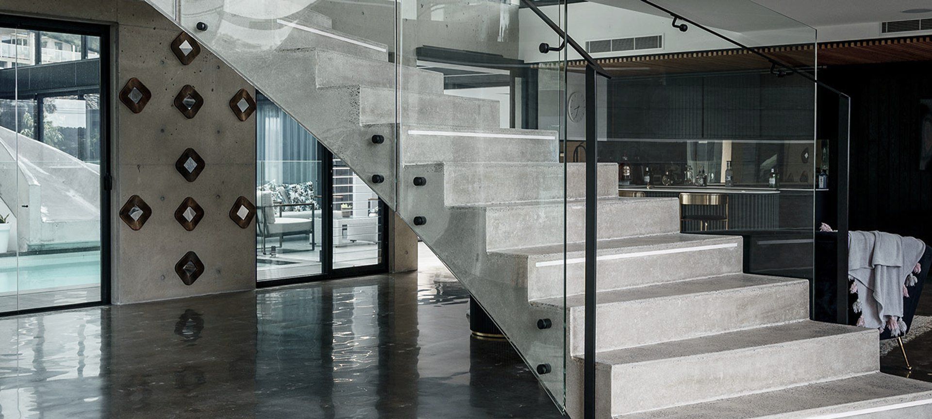 The Esplanade – Twin Bent Glass Curved Staircase banner