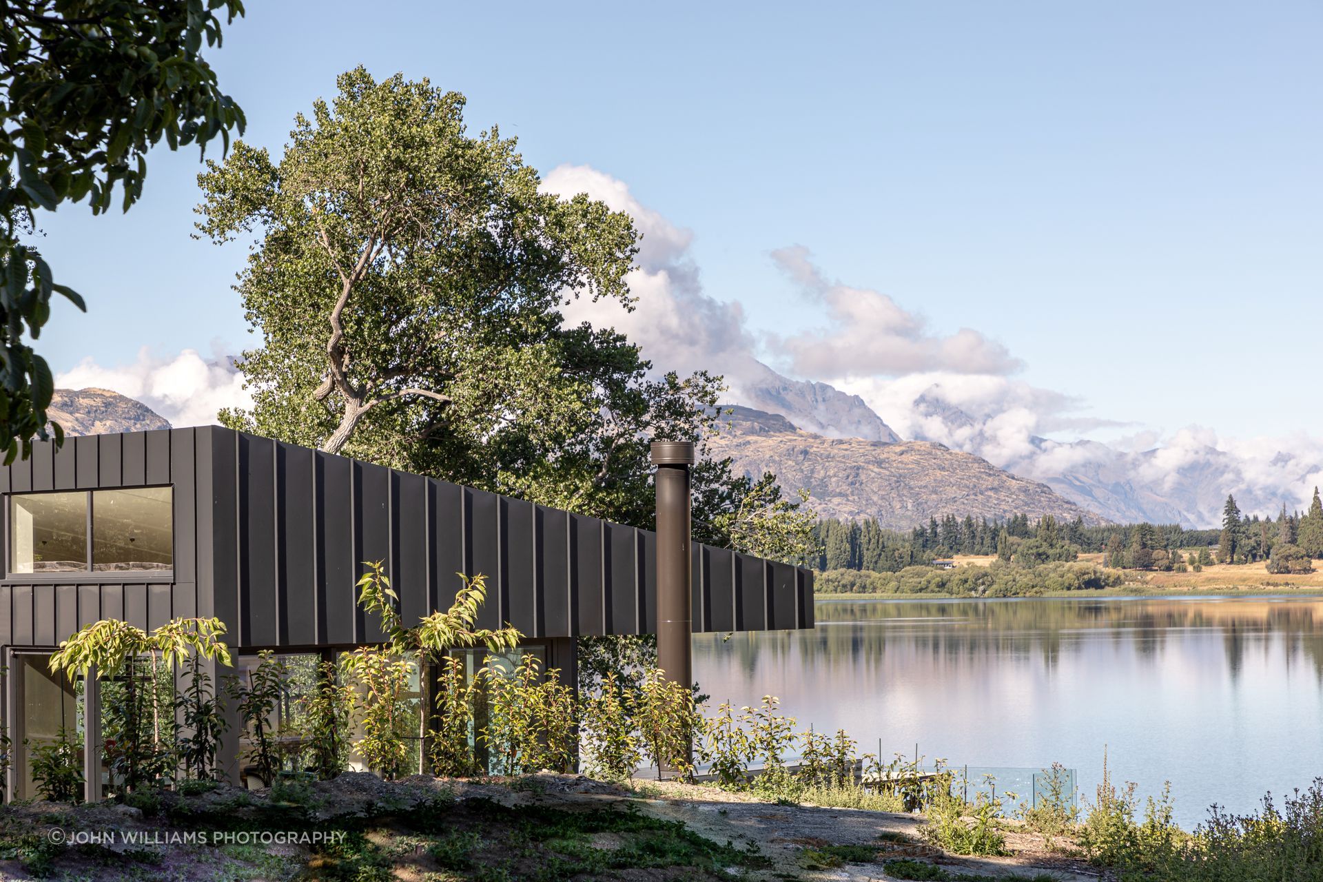 012-Ben-Hudson-Architects-Lake-House-outdoor-terrace-lake-view-v3.jpg