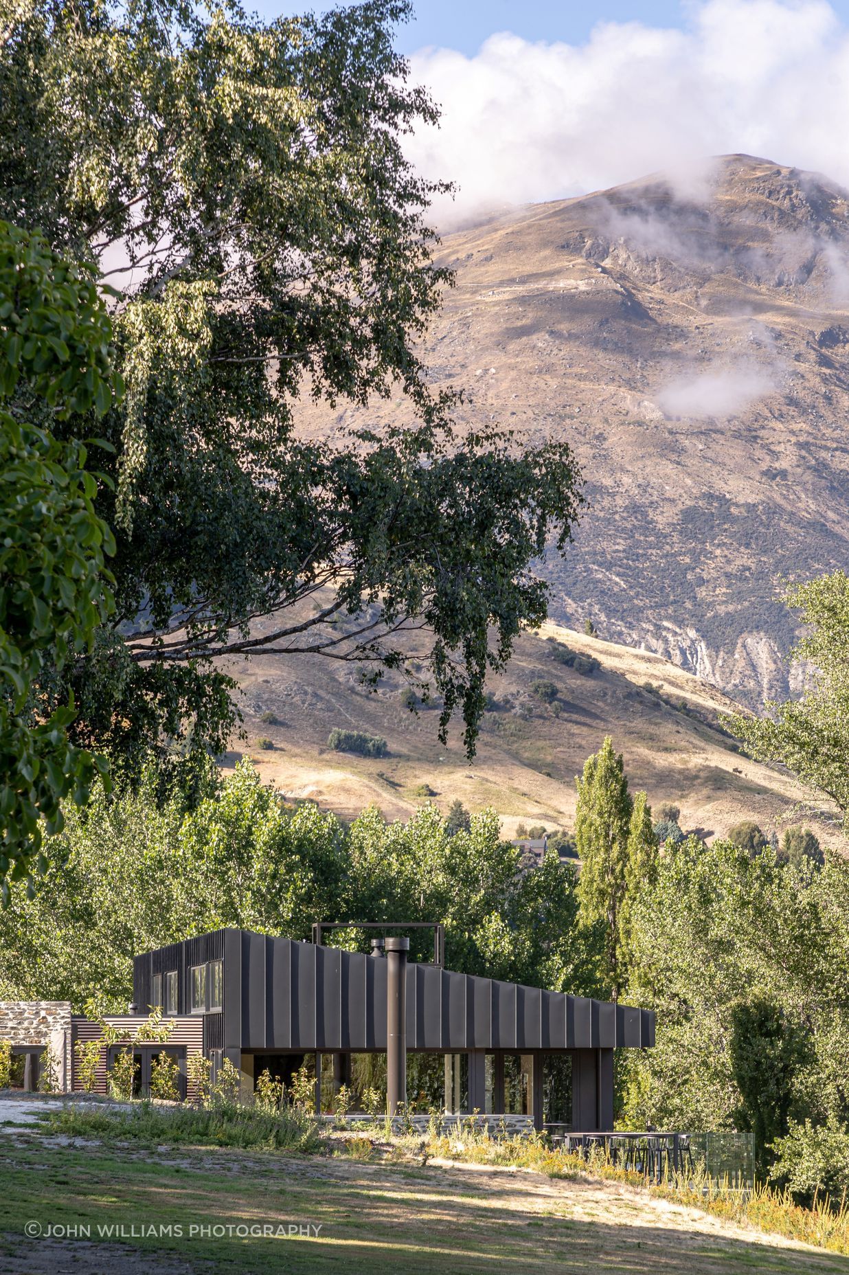 026-Ben-Hudson-Architects-Lake-House-set-in-landscape.jpg