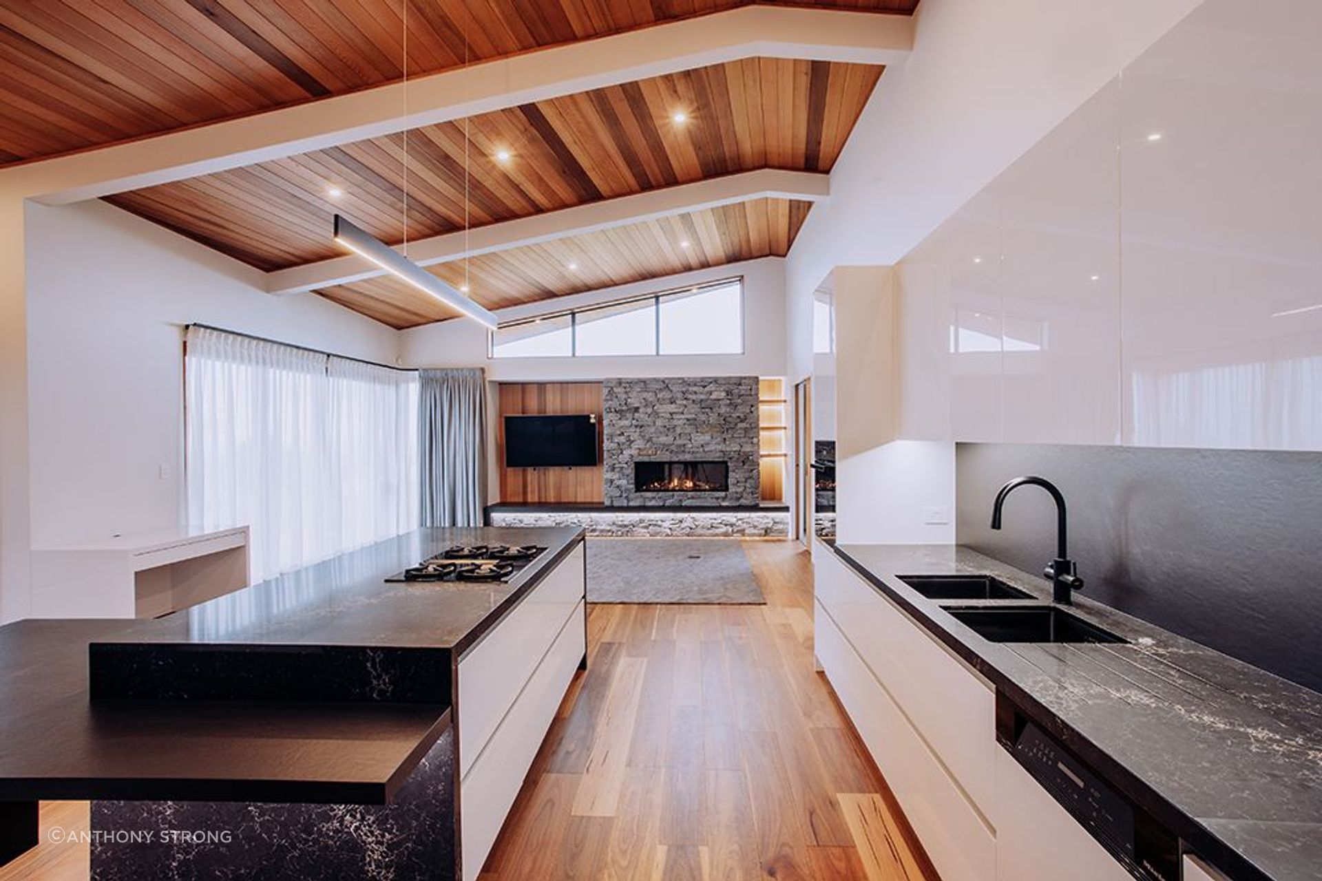 Warm timber accents and generous sunlight stream in through the expansive windows of the living wing. A Kitchen Area designed for entertaining the whole family, the open floor plan allows for a sense of sense of spaciousness.