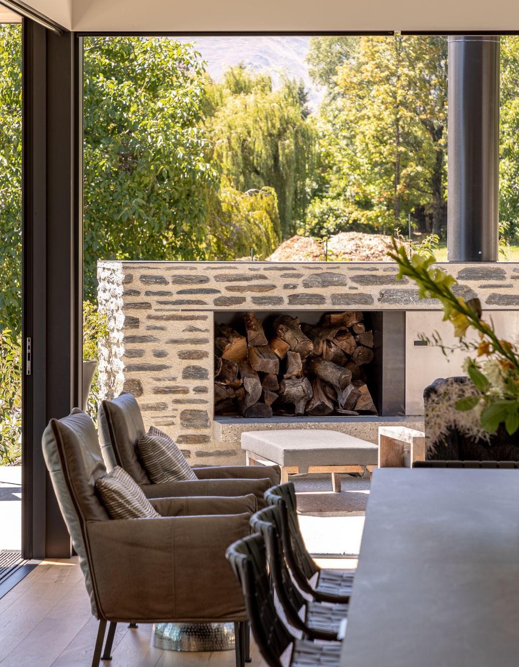 032-Ben-Hudson-Architects-Lake-House-outdoor-fire-and-dining.jpg