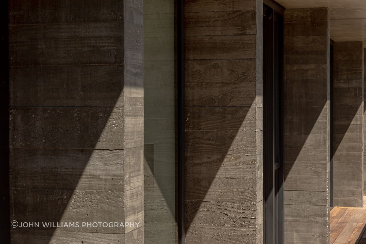 044-Ben-Hudson-Architects-Lake-House-textured-concrete-fins.jpg