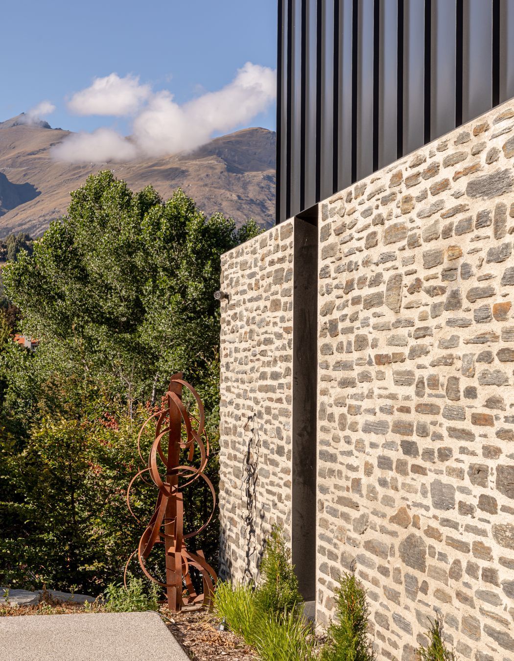 057-Ben-Hudson-Architects-Lake-House-stone-steel-detail.jpg