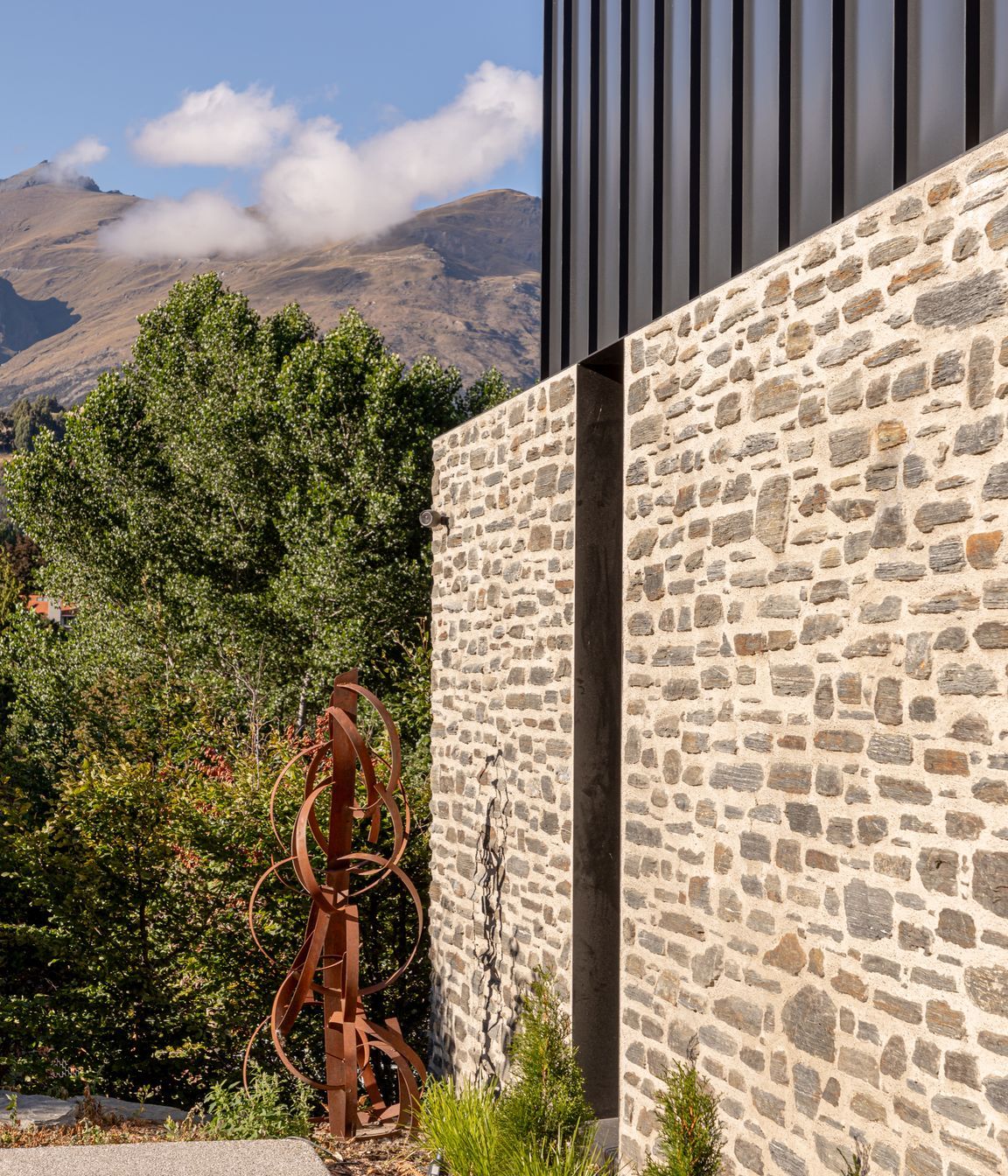 057-Ben-Hudson-Architects-Lake-House-stone-steel-detail.jpg