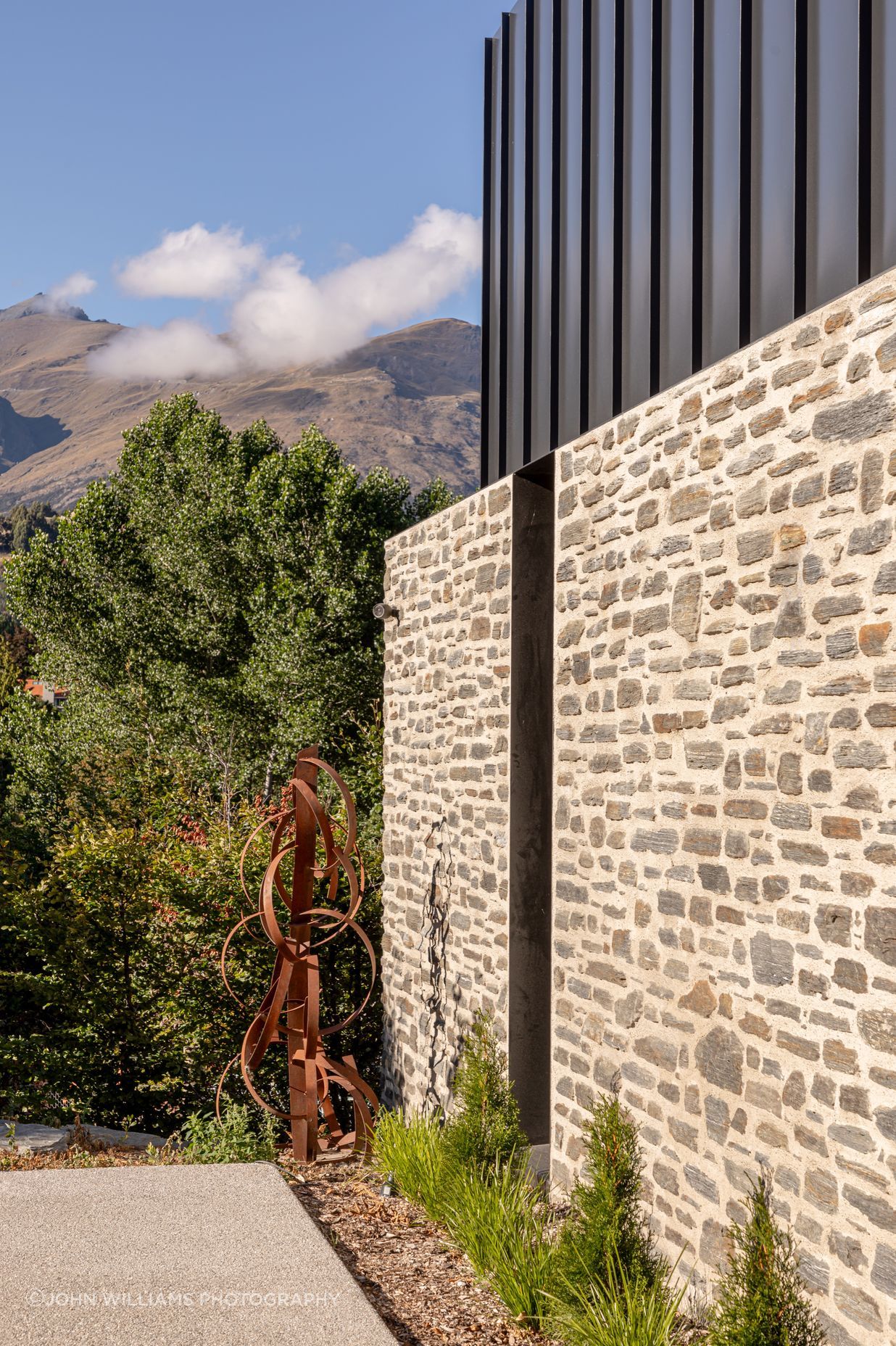 057-Ben-Hudson-Architects-Lake-House-stone-steel-detail.jpg