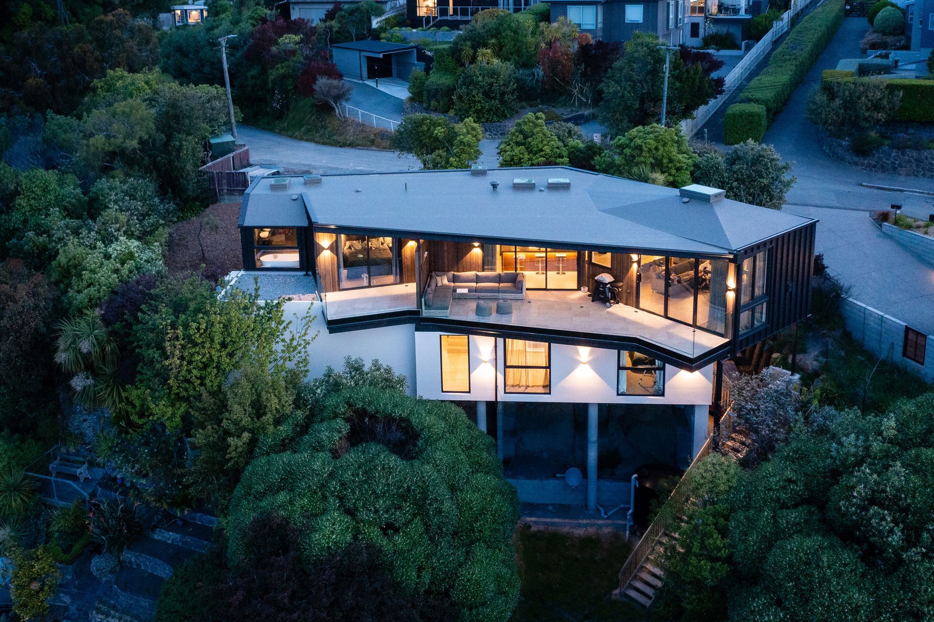 The existing greenery on the site was retained so that the home nestles easily into the landscape.