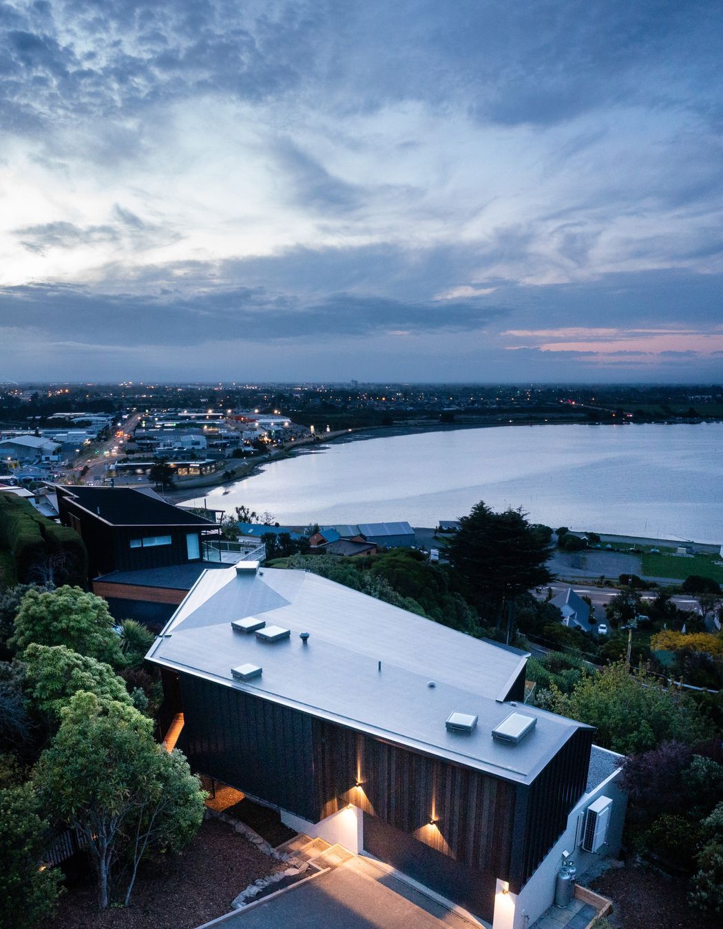 The home captures stunning sea and city views.