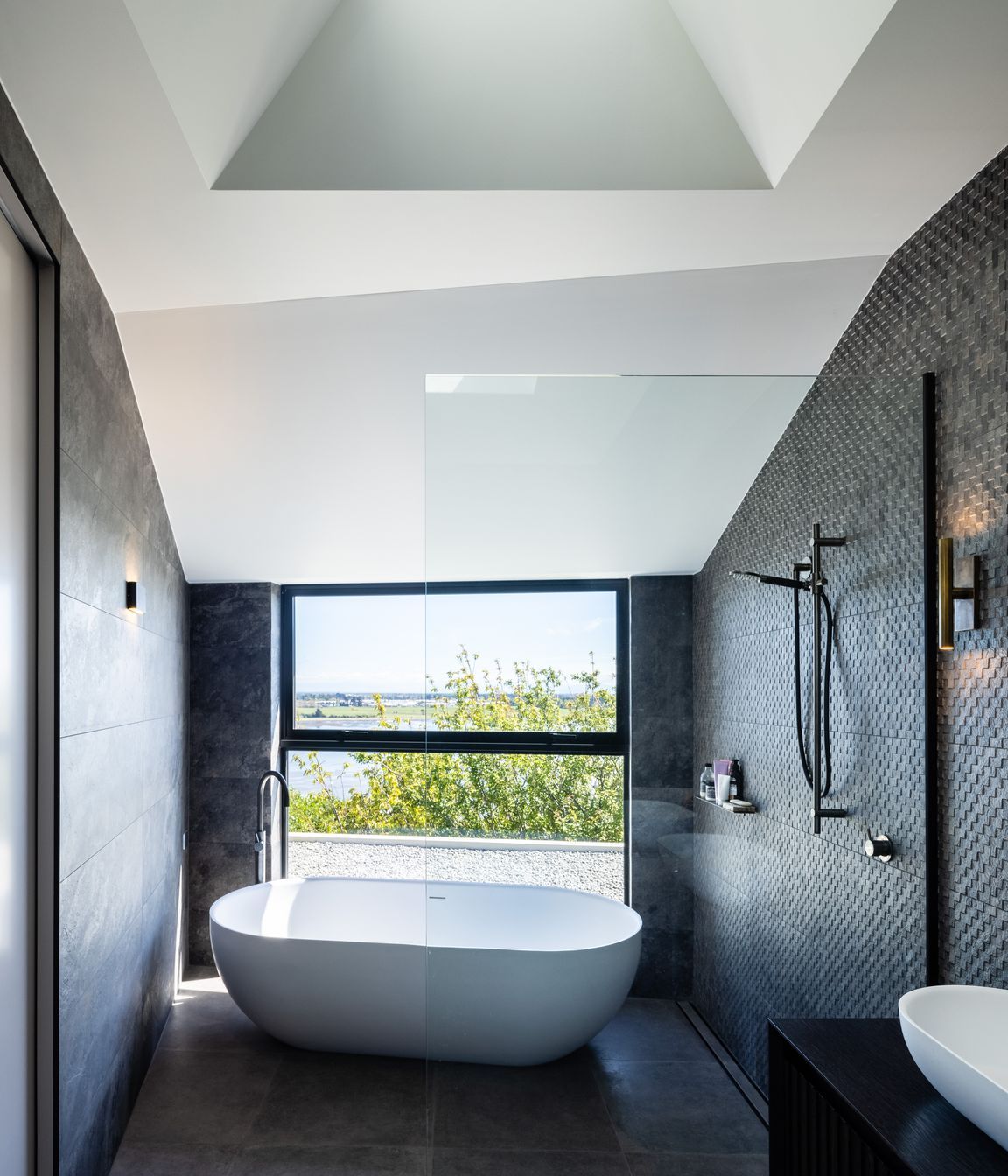 The master en suite bath and shower enjoy a dramatic view.