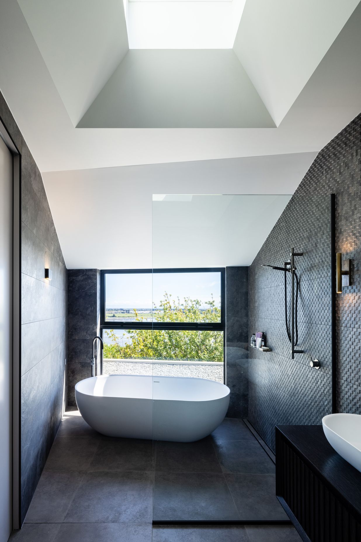 The master en suite bath and shower enjoy a dramatic view.