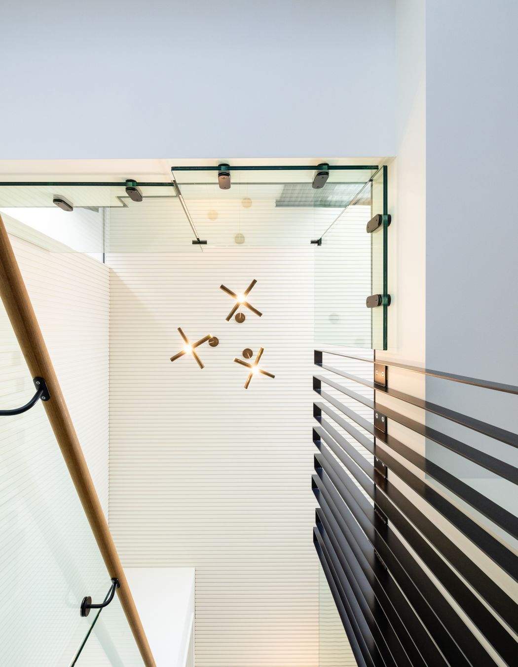 A dramatic view to the ceiling above the stairs.