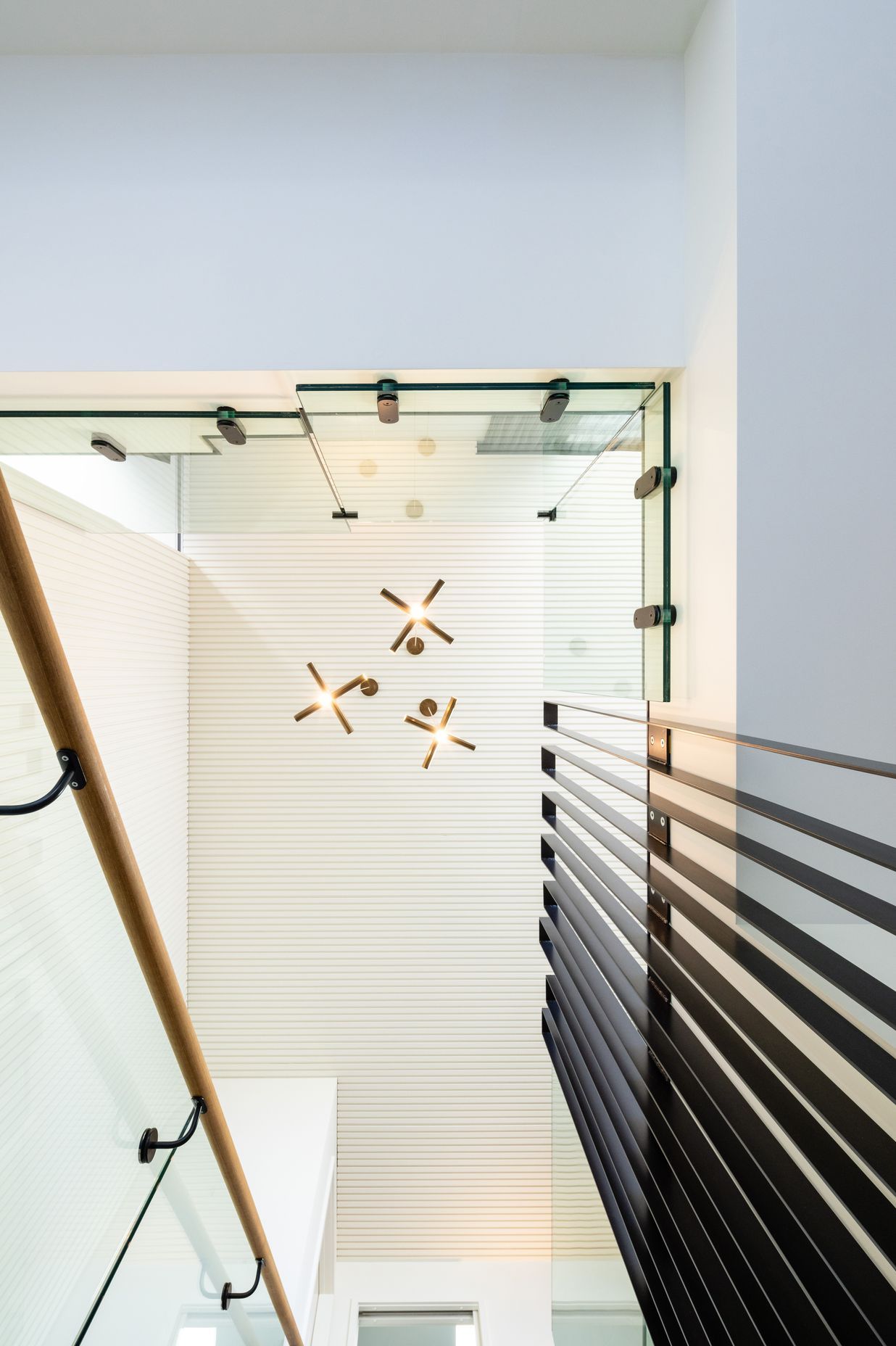 A dramatic view to the ceiling above the stairs.