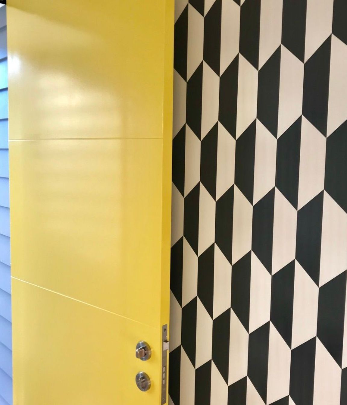 How's this for a joyful entrance! Resene Turbo opening onto a classic black and white geometric wallpaper in the St Albans new build.
