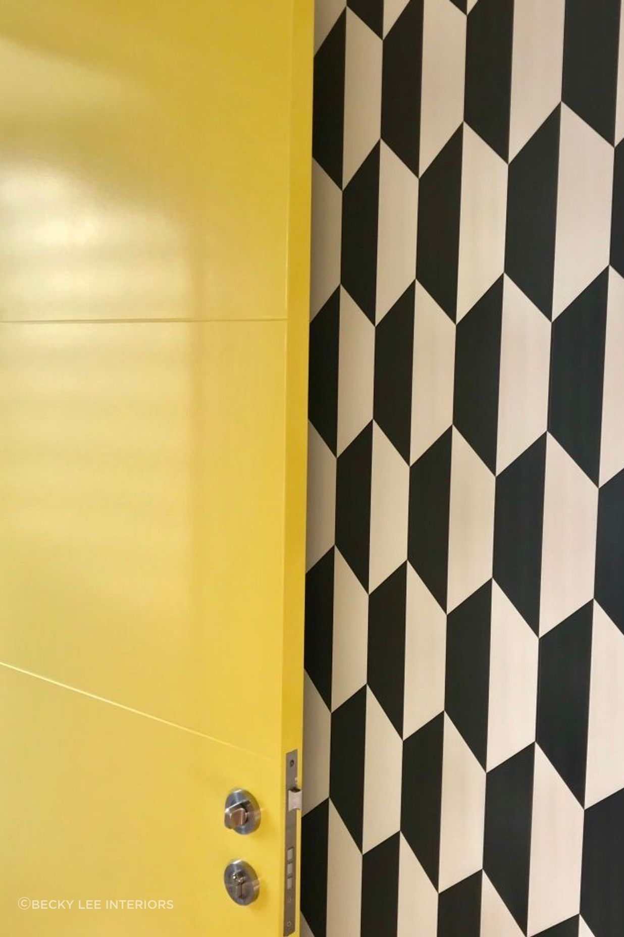 How's this for a joyful entrance! Resene Turbo opening onto a classic black and white geometric wallpaper in the St Albans new build.