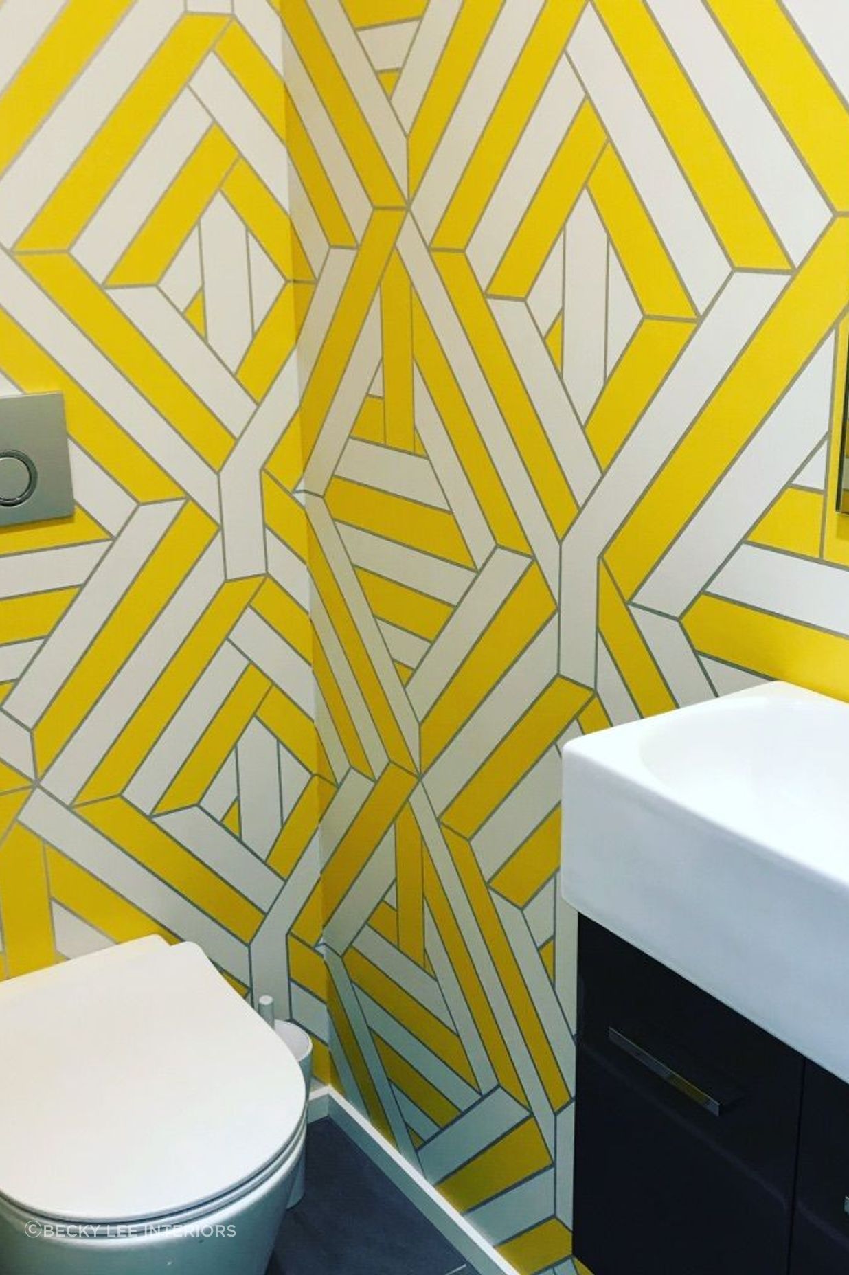 A very funky WC... the French geometric wallpaper on all four walls really packs a punch in this St Albans new build.!