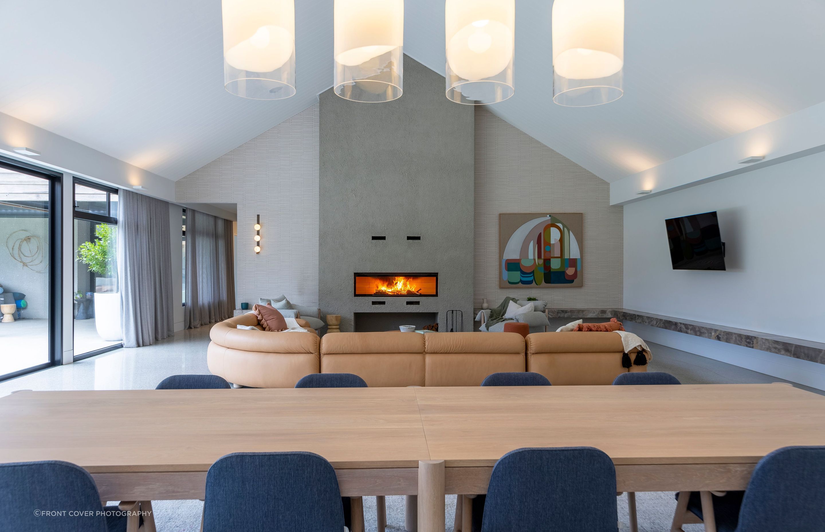 Nestle into the cozy embrace of our lounge room, adorned with a magnificent large wood fireplace, where warmth and ambiance merge to create the perfect setting for relaxation and cherished moments