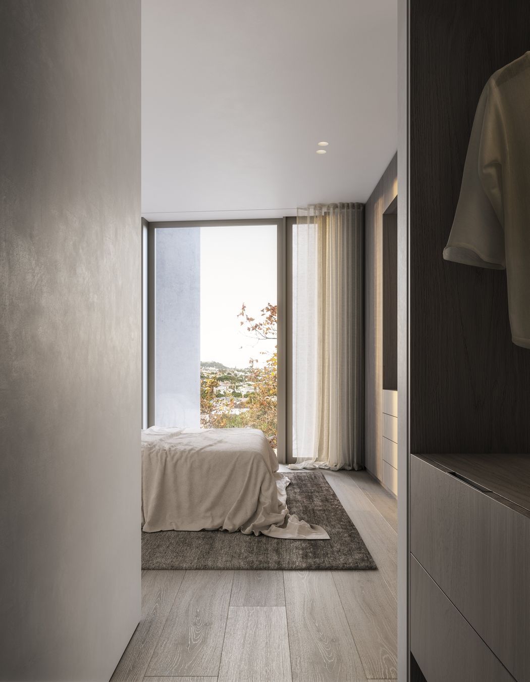 Stained-oak cabinetry and rendered walls compliment one another and bring a tactile sense of luxury to each apartment.
