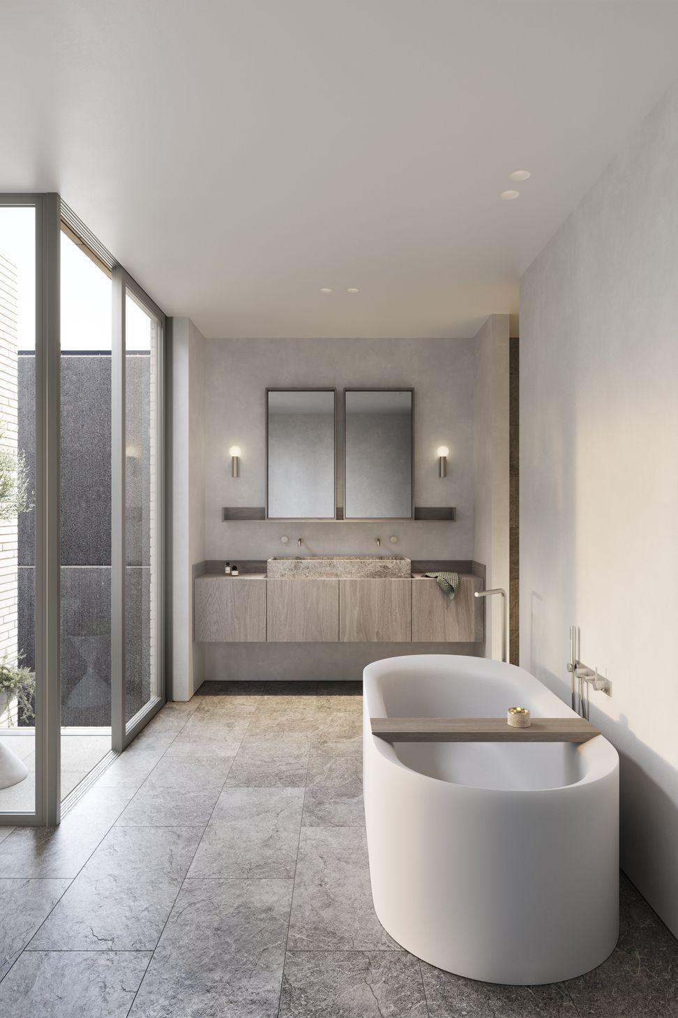 Tumbled marble tiles and carved stone basins imbue bathrooms with an elegant tactility.