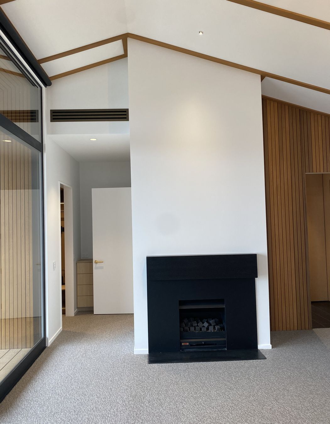Clever automated blinds give a minimalist look to this home removing the need for fussy chains.