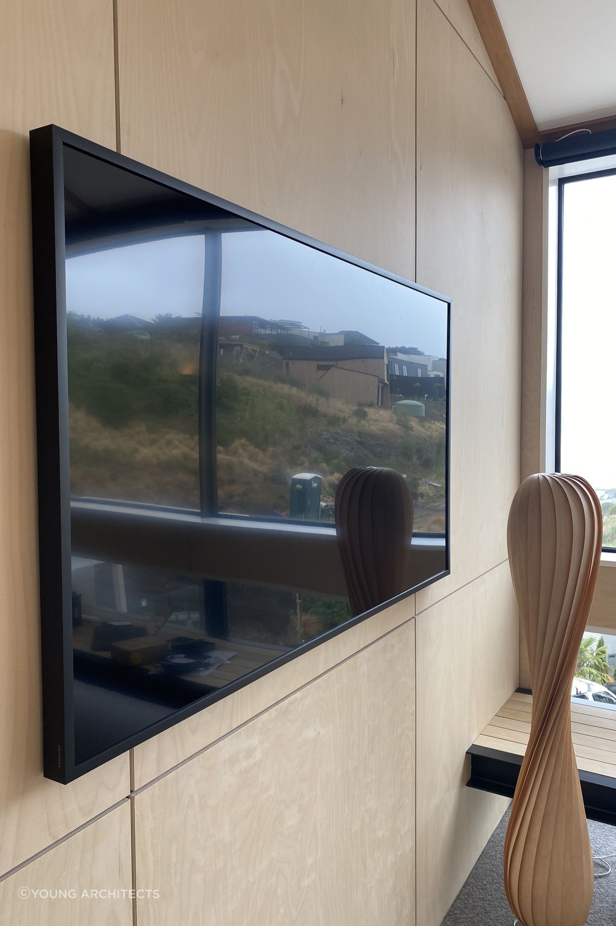 Media room with amplifier hidden in wall cavity.