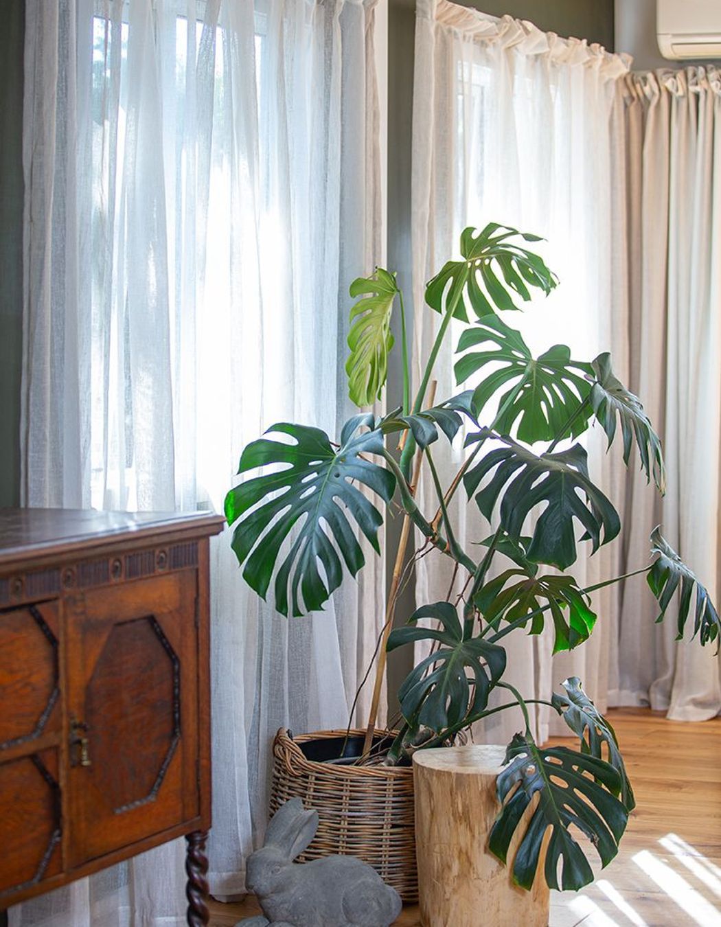 A large 60's fireplace and existing front door was removed to enlarge this room, and allow more light in through a new window to match.