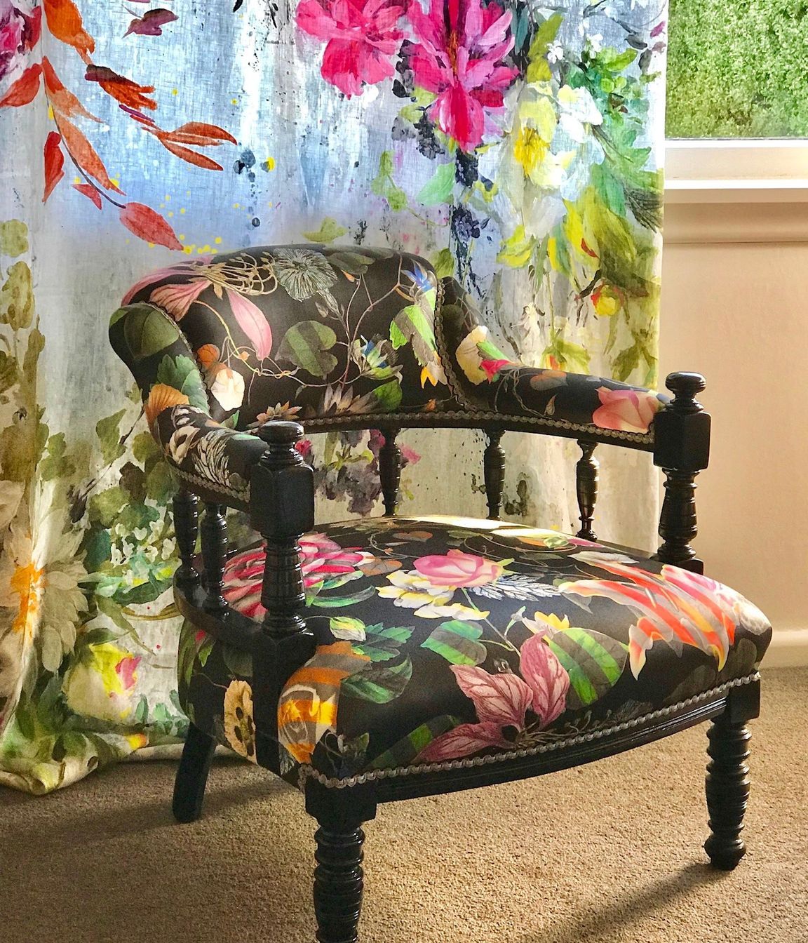 An heirloom Captains Chair was given a vibrant makeover with some black gloss lacquer and an edgy Christian Lacroix furnishing fabric.