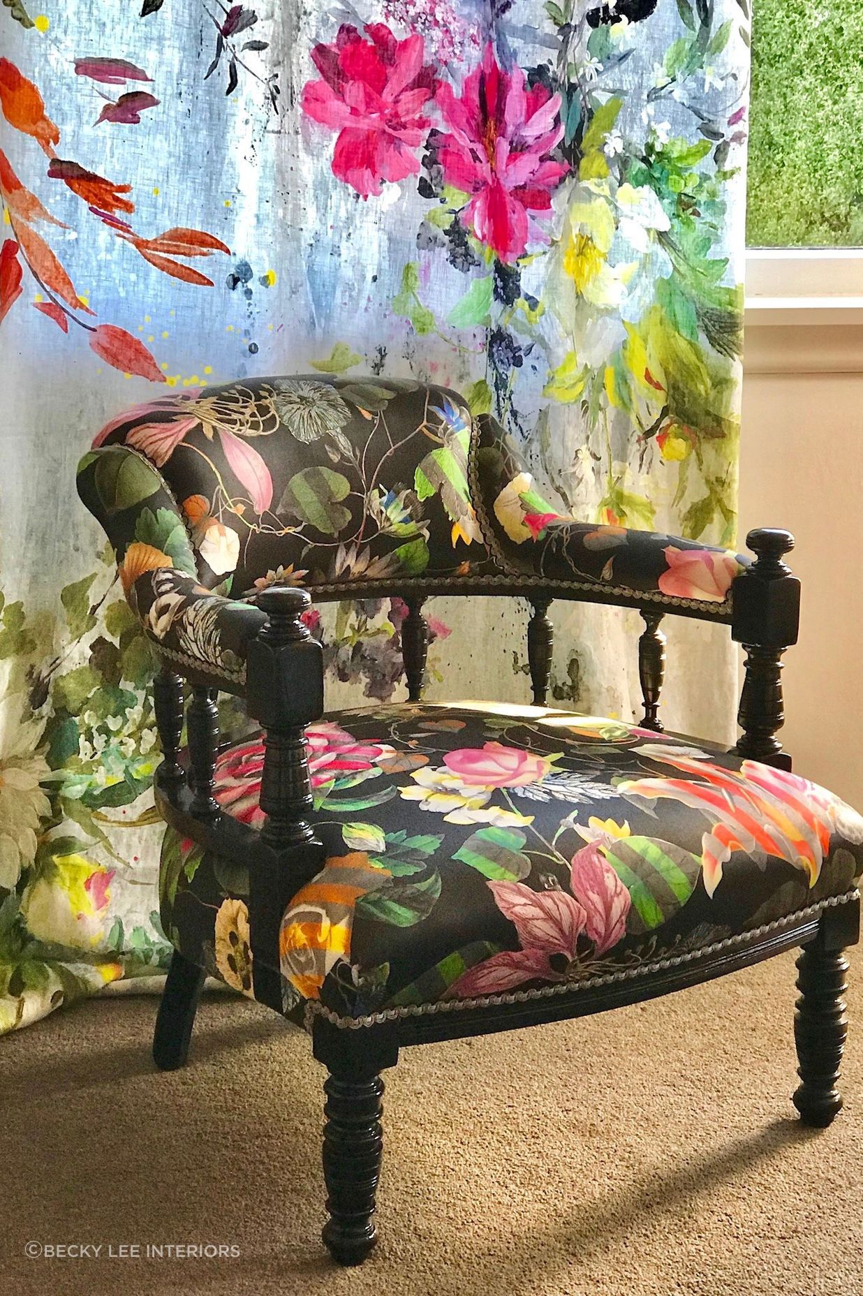 An heirloom Captains Chair was given a vibrant makeover with some black gloss lacquer and an edgy Christian Lacroix furnishing fabric.