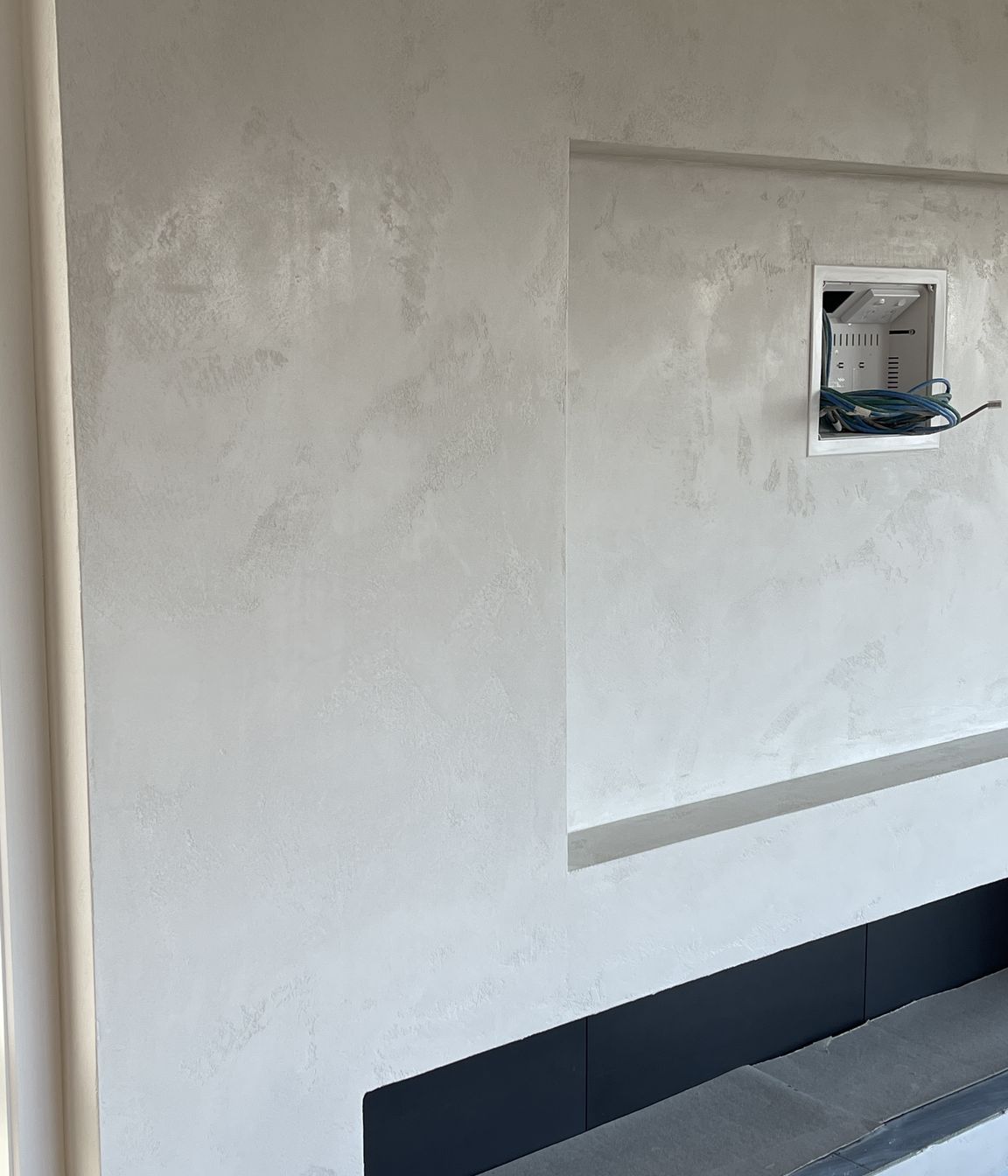 Resistone microcement fireplace
