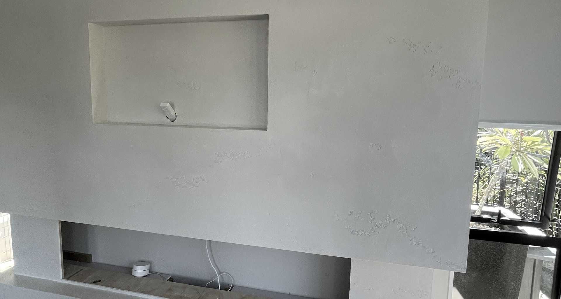 Resistone microcement fireplace banner
