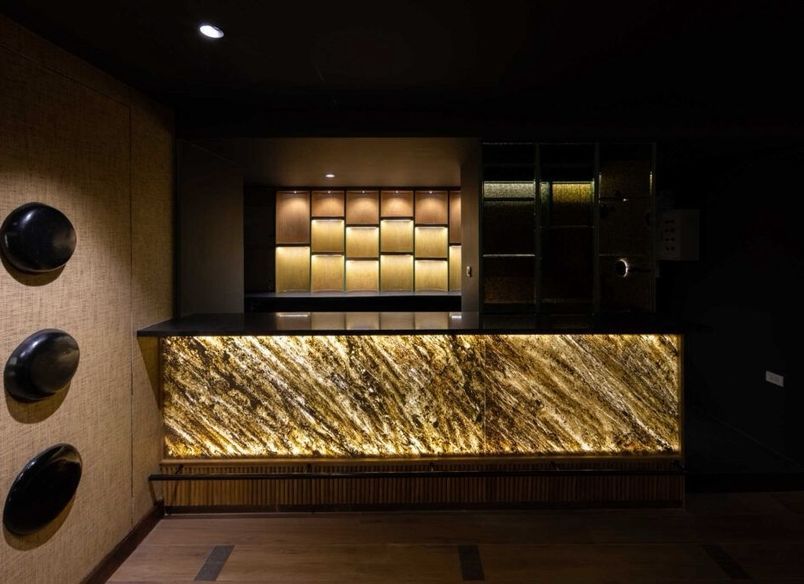 Lucifer-Inspired Bar Design with Translucent Real Stone