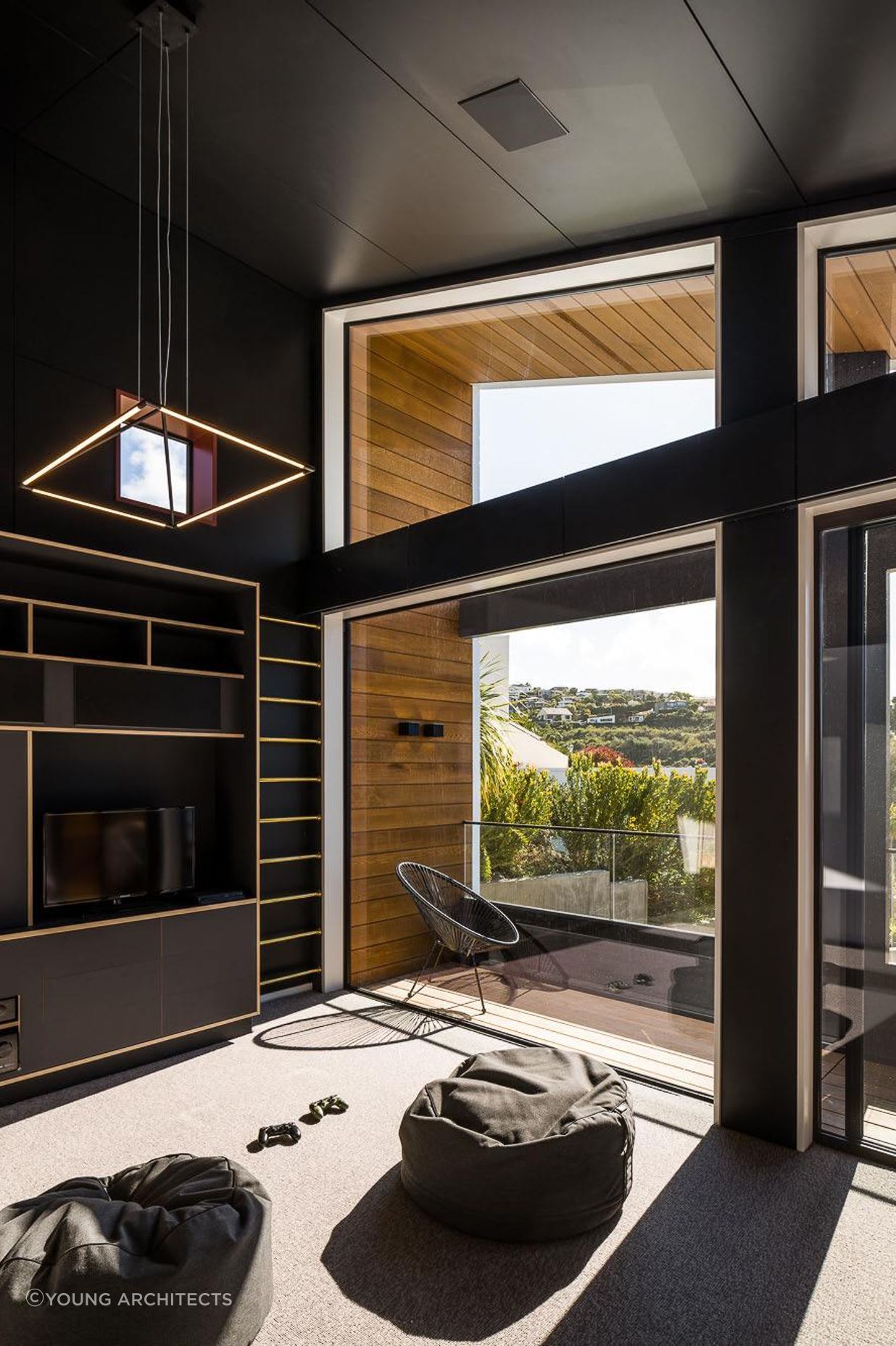 Discrete electrical work was concealed in a cavity behind the media room cabinetry.