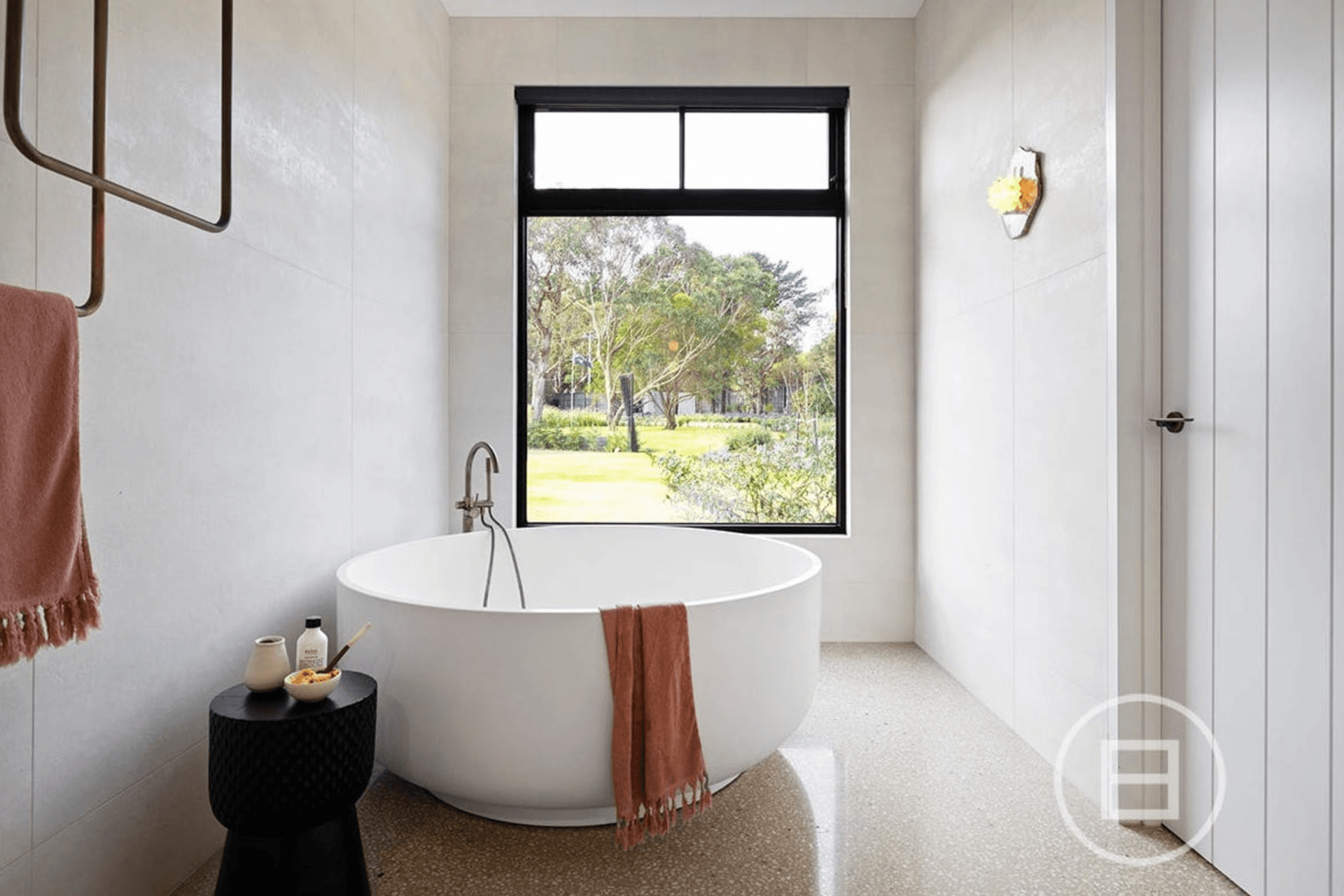 Featuring round freestanding bathtub with luscious Greenland views, this bathroom is the embodiment of relaxation