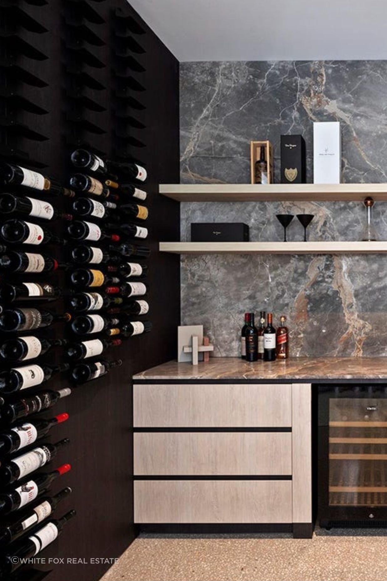 Reaching the height of opulence, this home features an extra large wine cellar with marble finishes