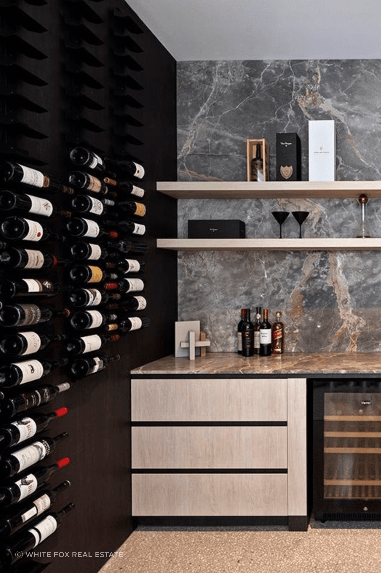 Reaching the height of opulence, this home features an extra large wine cellar with marble finishes