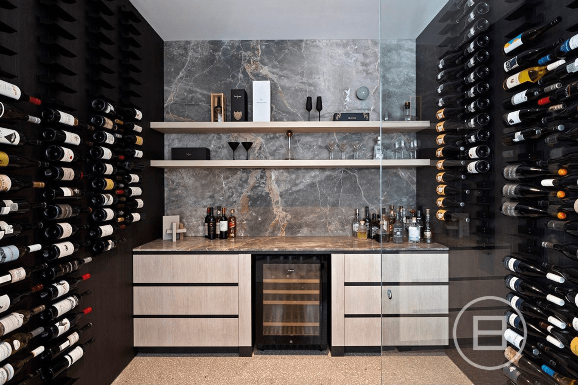 Reaching the height of opulence, this home features an extra large wine cellar with marble finishes