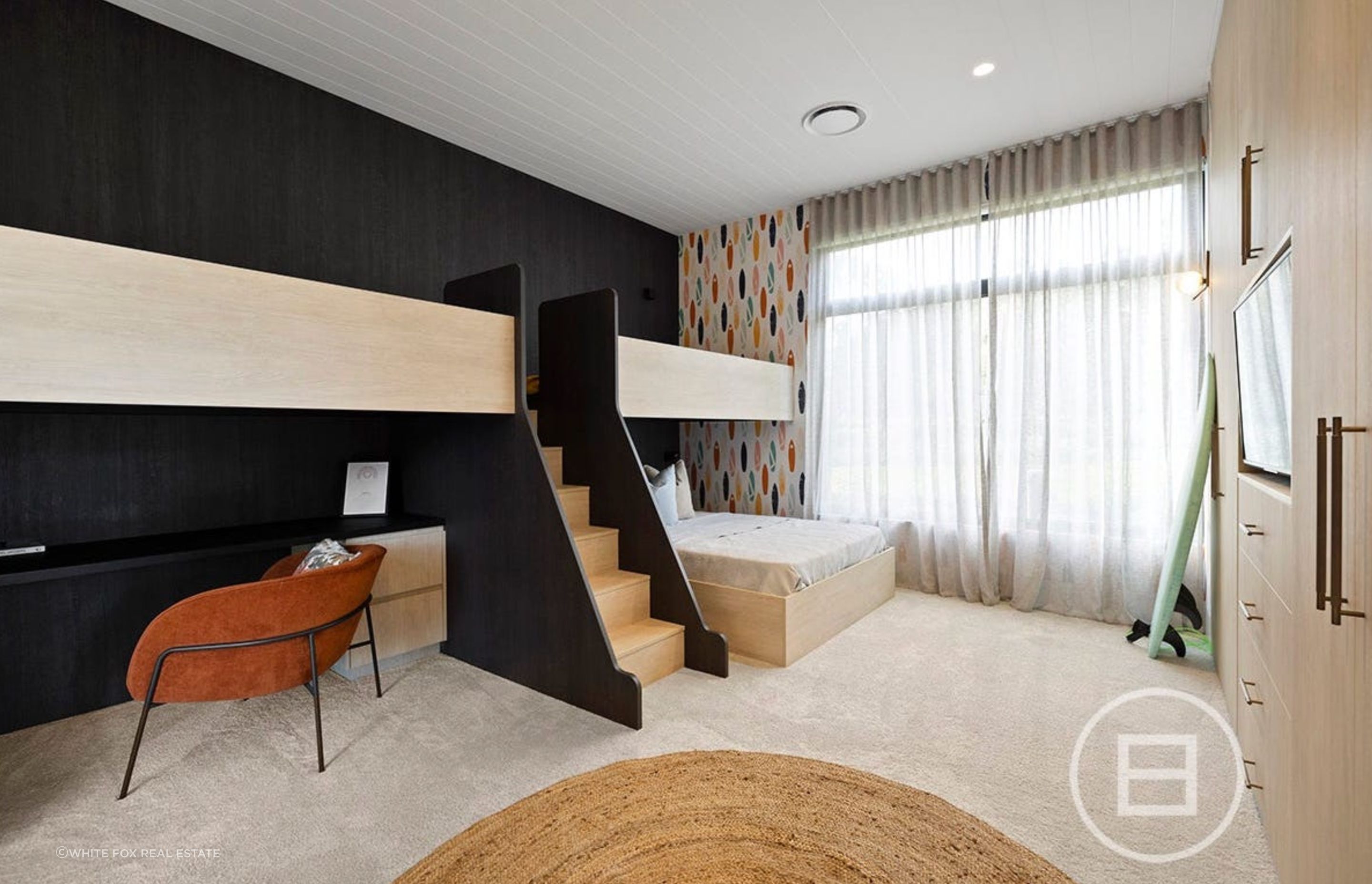 Creating a serene and tranquil space that fosters creativity and calmness, this children's bedroom features featuring minimalist tones and clean lines