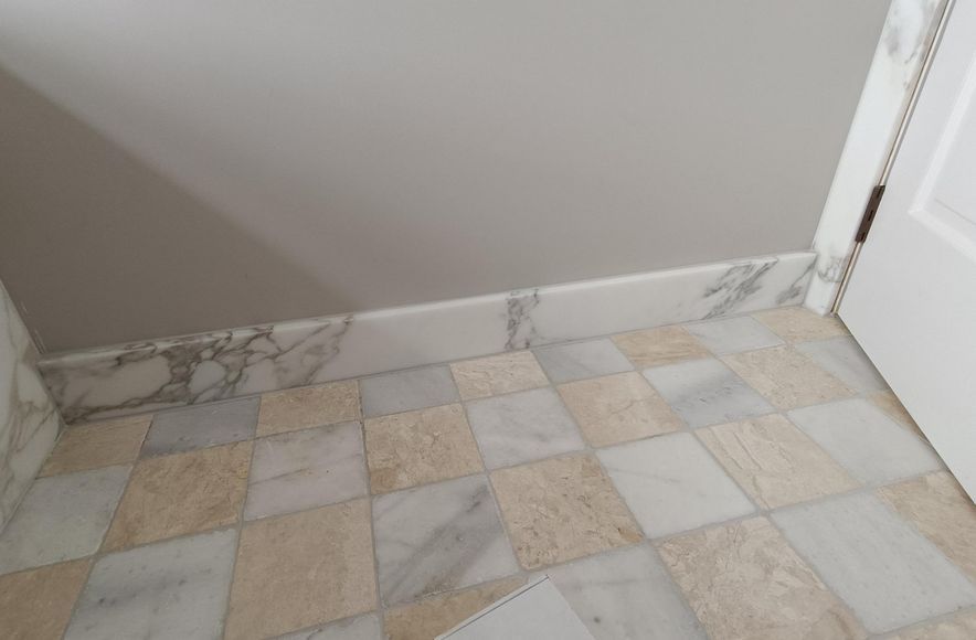 Damn Good Tiling - marble stone tiling w skirting