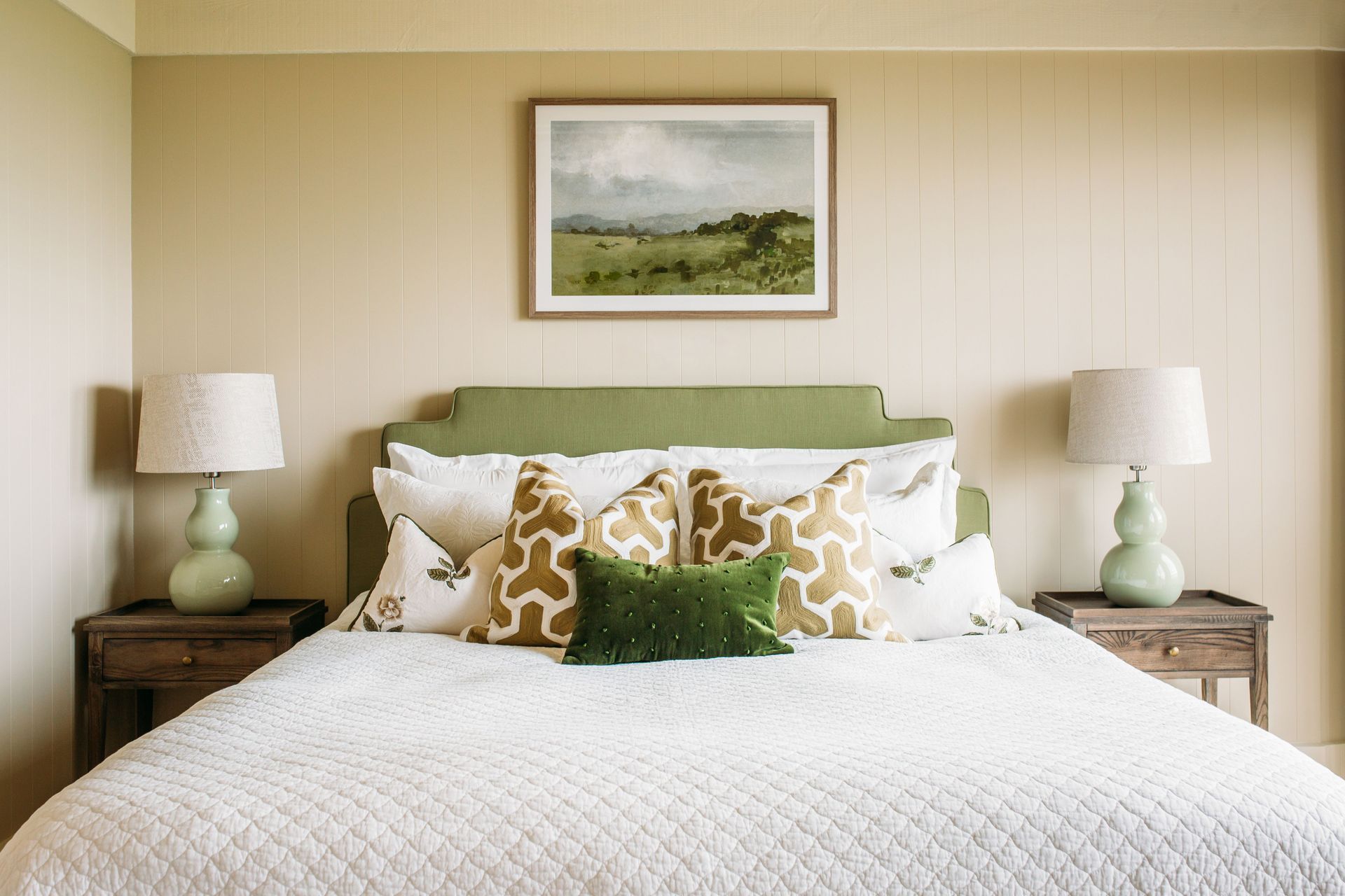 A bedroom in Foley Villa. The bedside lamps are by Eunice Taylor.
