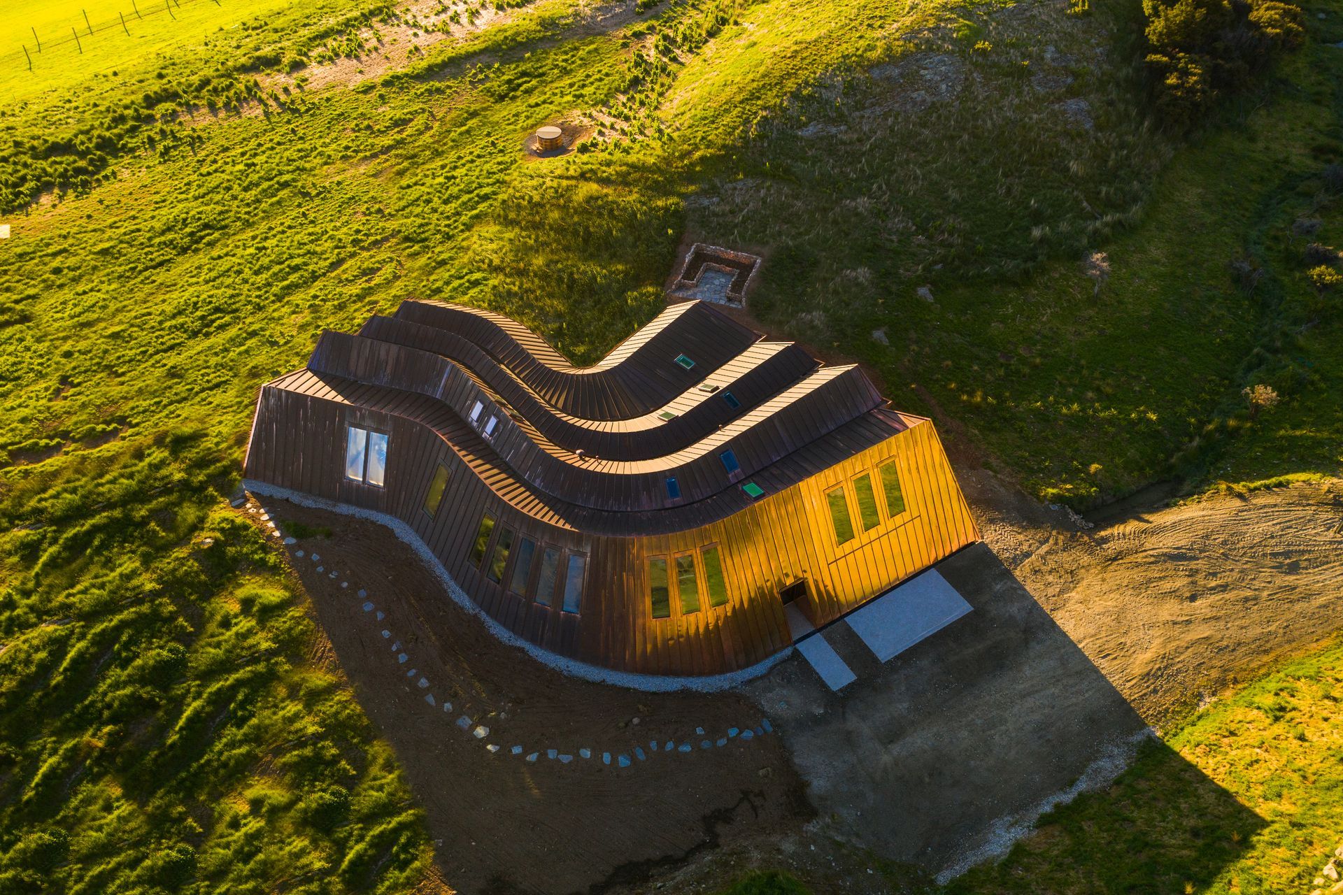 The client was also inspired by the Riverside Museum in Glasgow by Zaha Hadid Architects, which also features flowing striations.