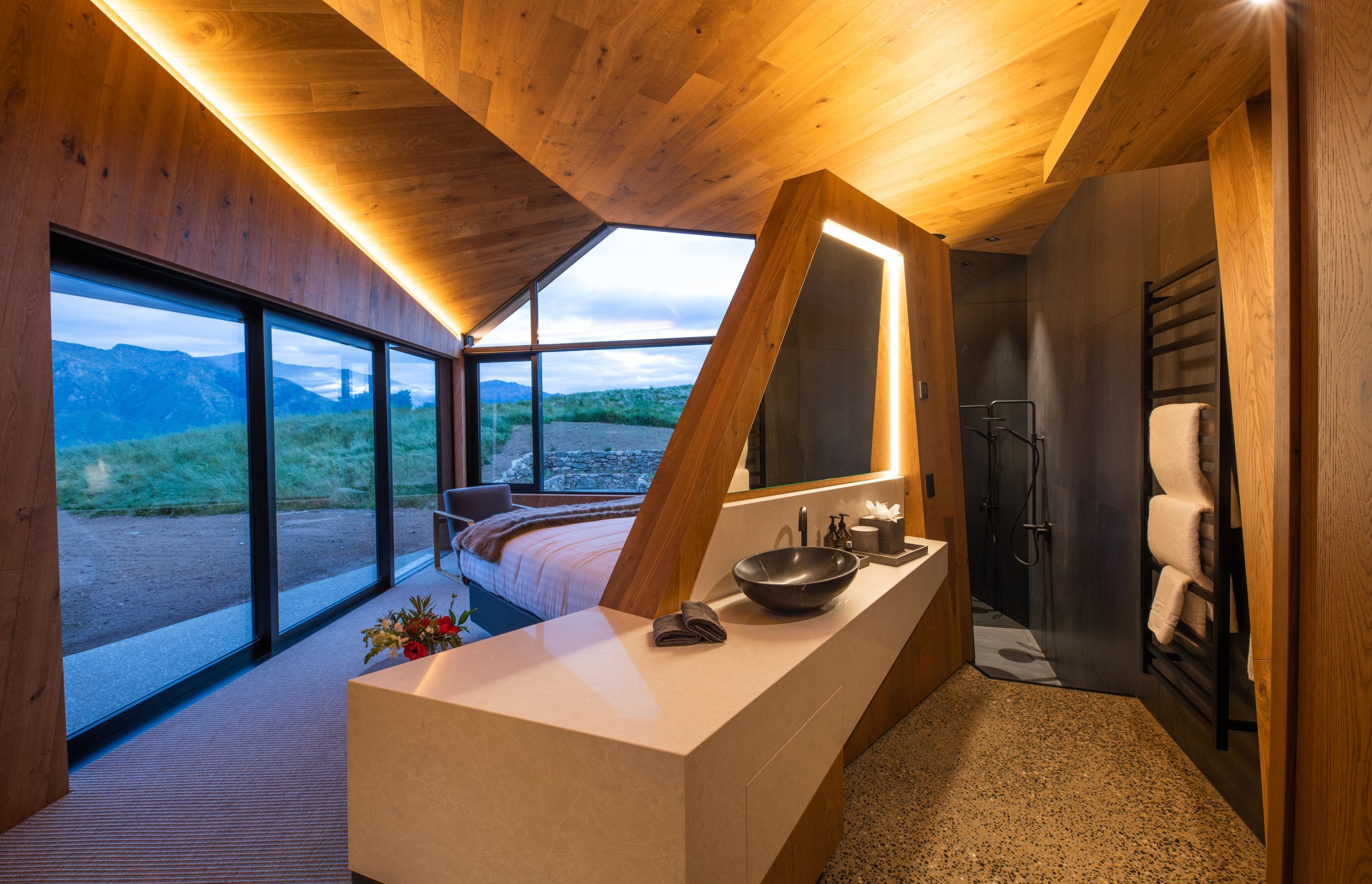 Ensuite bathrooms have been cleverly incorporated into the bedroom suites so that they too can take advantage of the views.