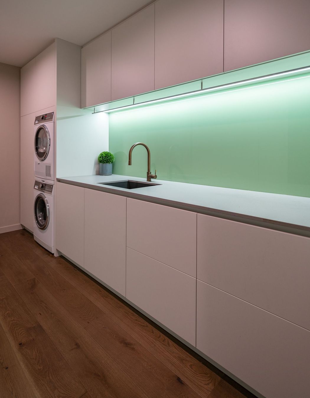 The laundry/utilities room is tucked downstairs behind the garage.